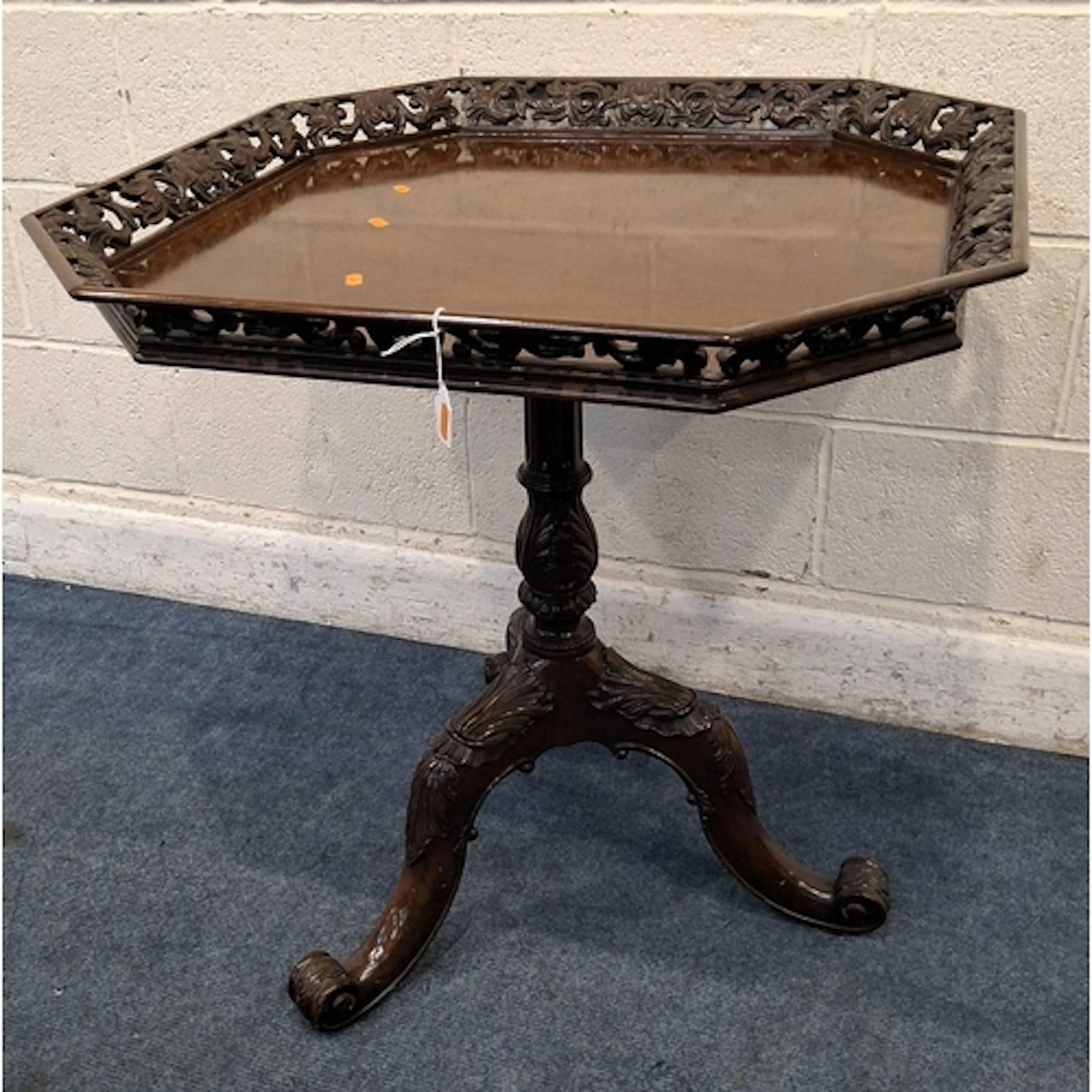 A REPRODUCTION MAHOGANY CHIPPENDALE STYLE TRIPOD TABLE, with...