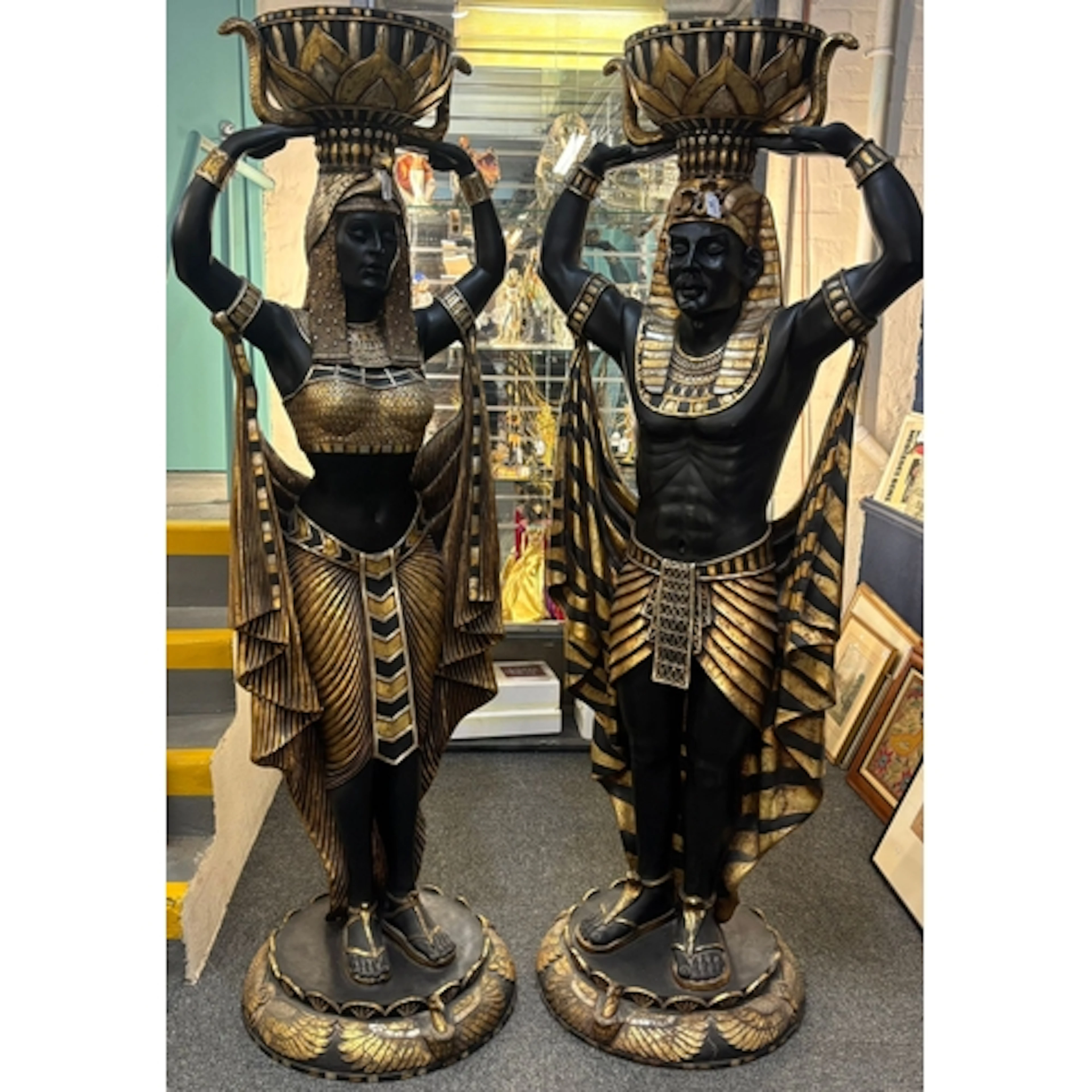 Pair of modern life size male and female Egyptian plant or j...