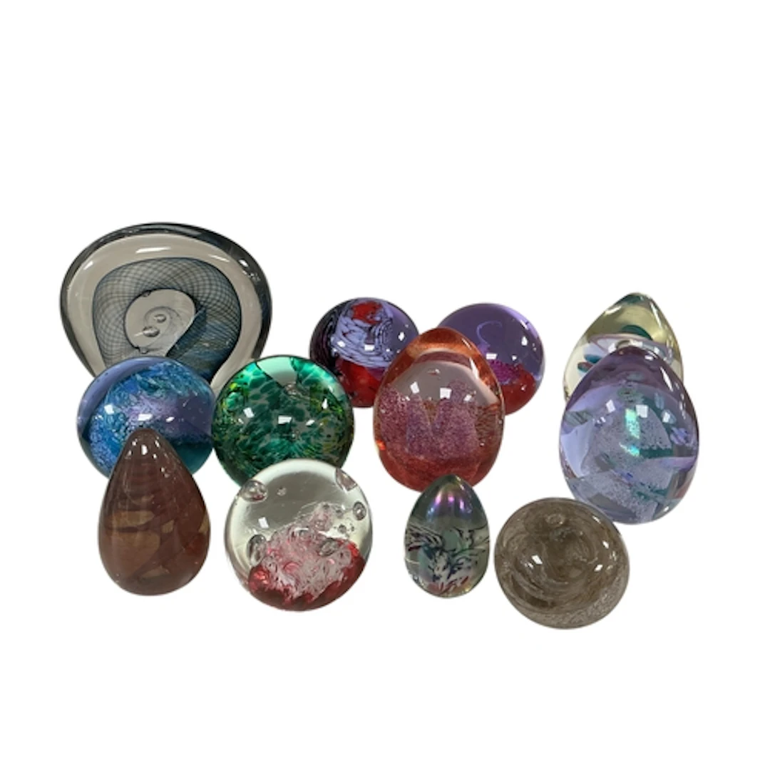 Twelve decorative glass paperweights by Caithness, largest 1...