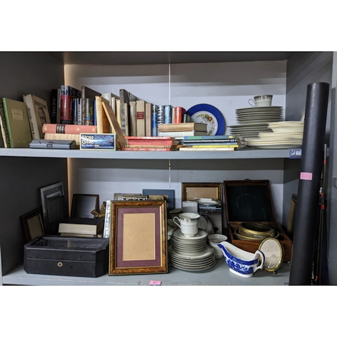 A mixed lot of books, tea wares, picture frames, and other i...