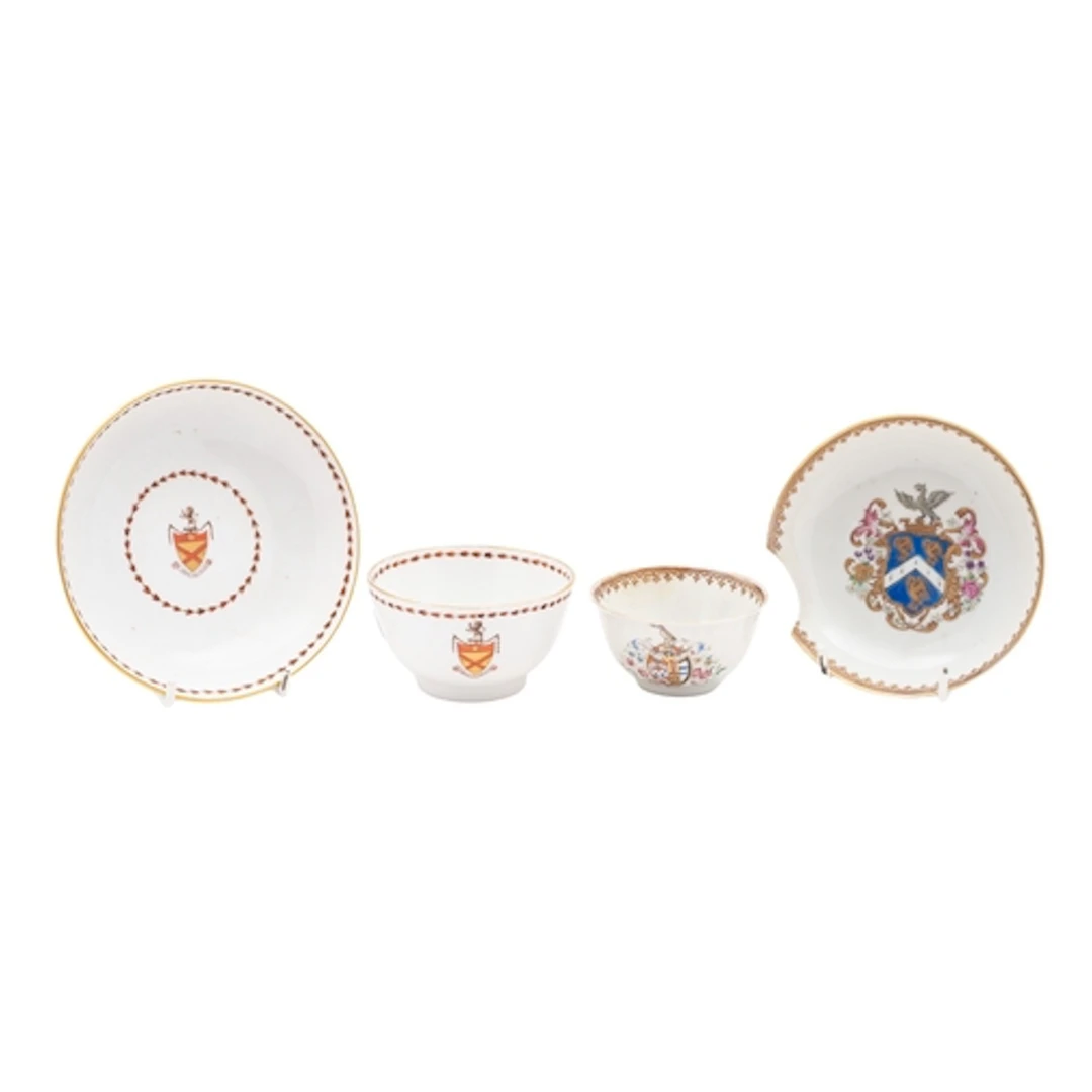 Two armorial tea bowls and saucers, one English late 18th ce...