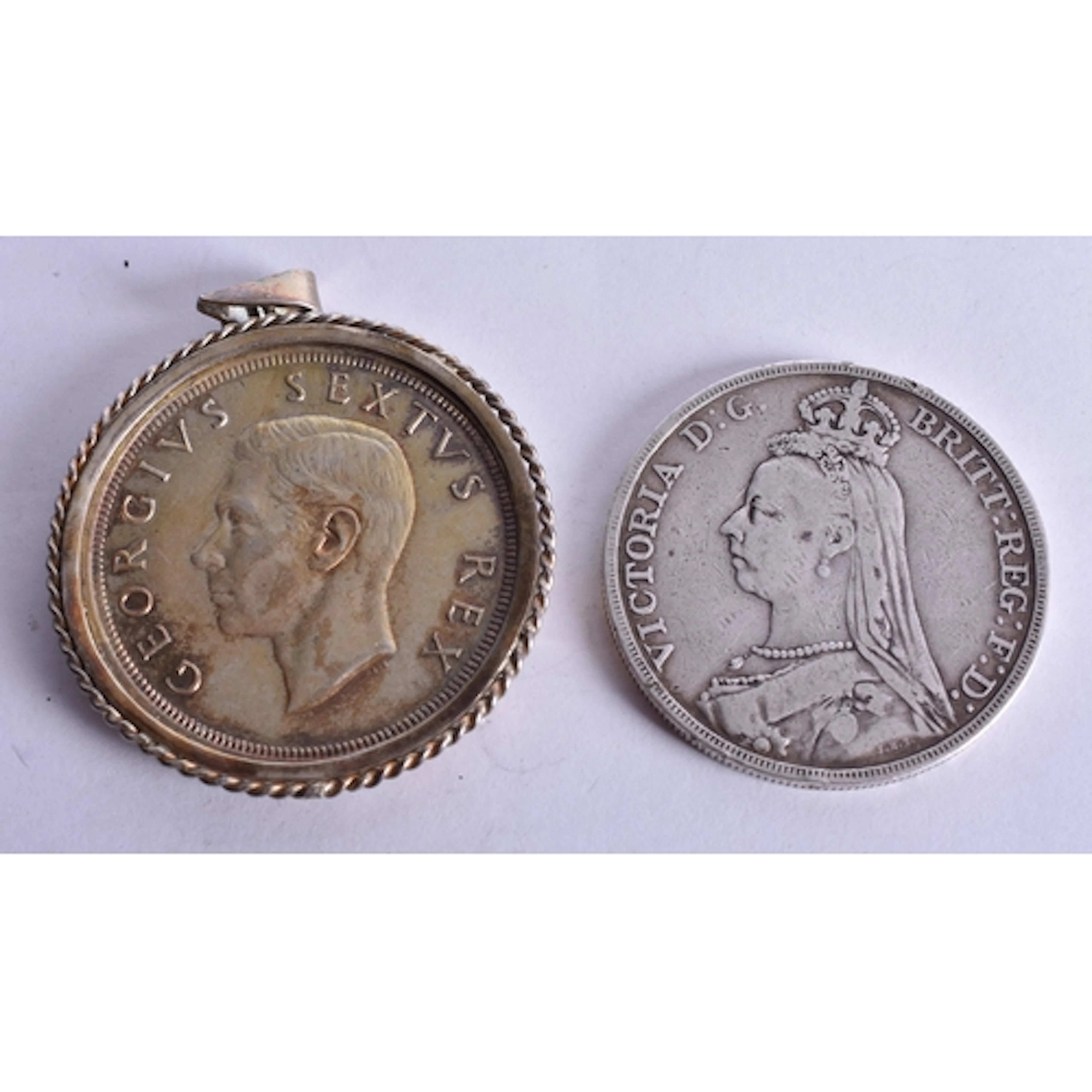 A MEDAL AND A COIN. 63.6 grams. (2)
