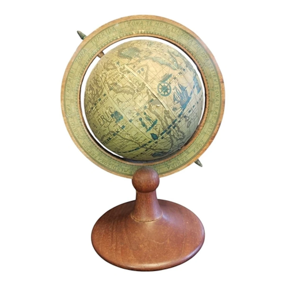 Mid century vintage desktop globe. Featuring an aged paper c...