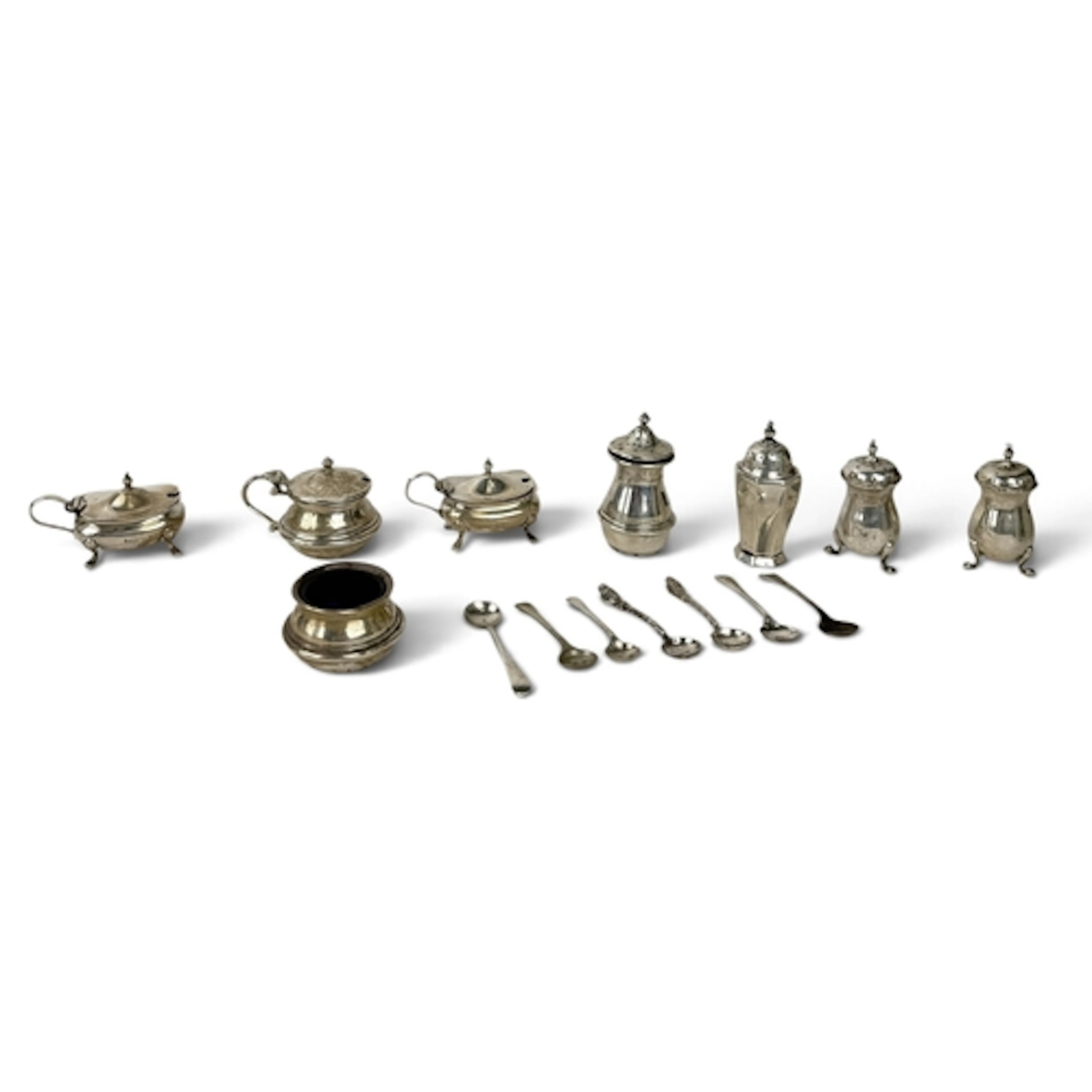 A GROUP OF SILVER CONDIMENTS AND VARIOUS SPOONS Total weigha...