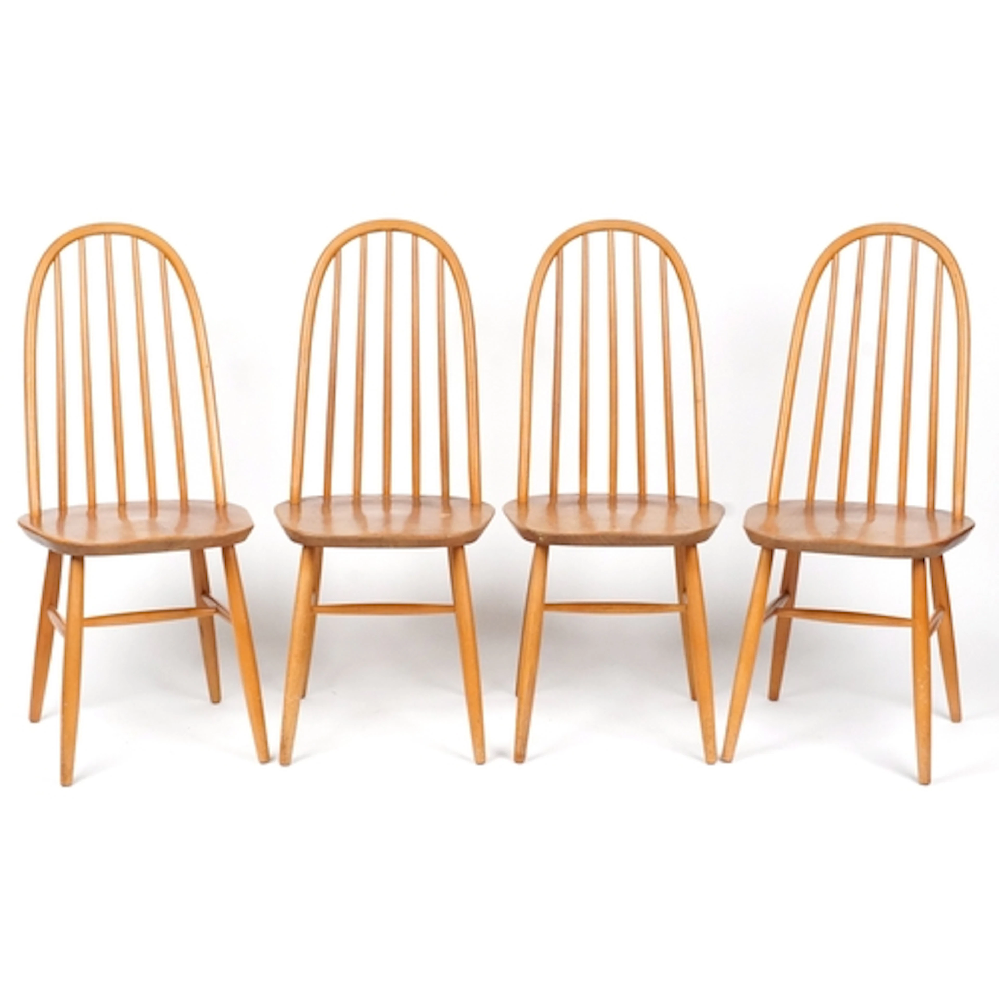 Set of four mid century beech spindle back dining chairs wit...