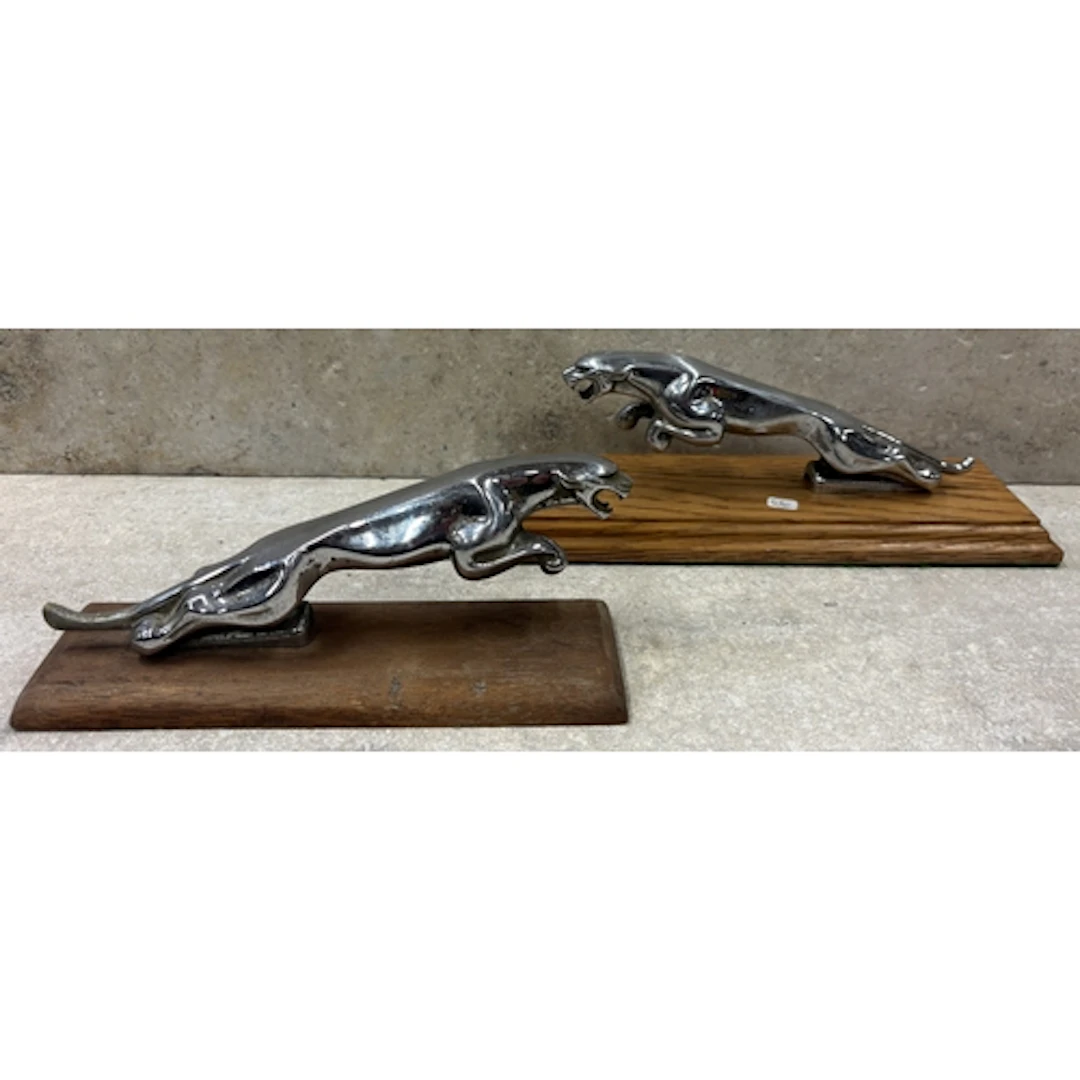Two 8" Jaguar bonnets mascots mounted on plinths. Est. £20 -...