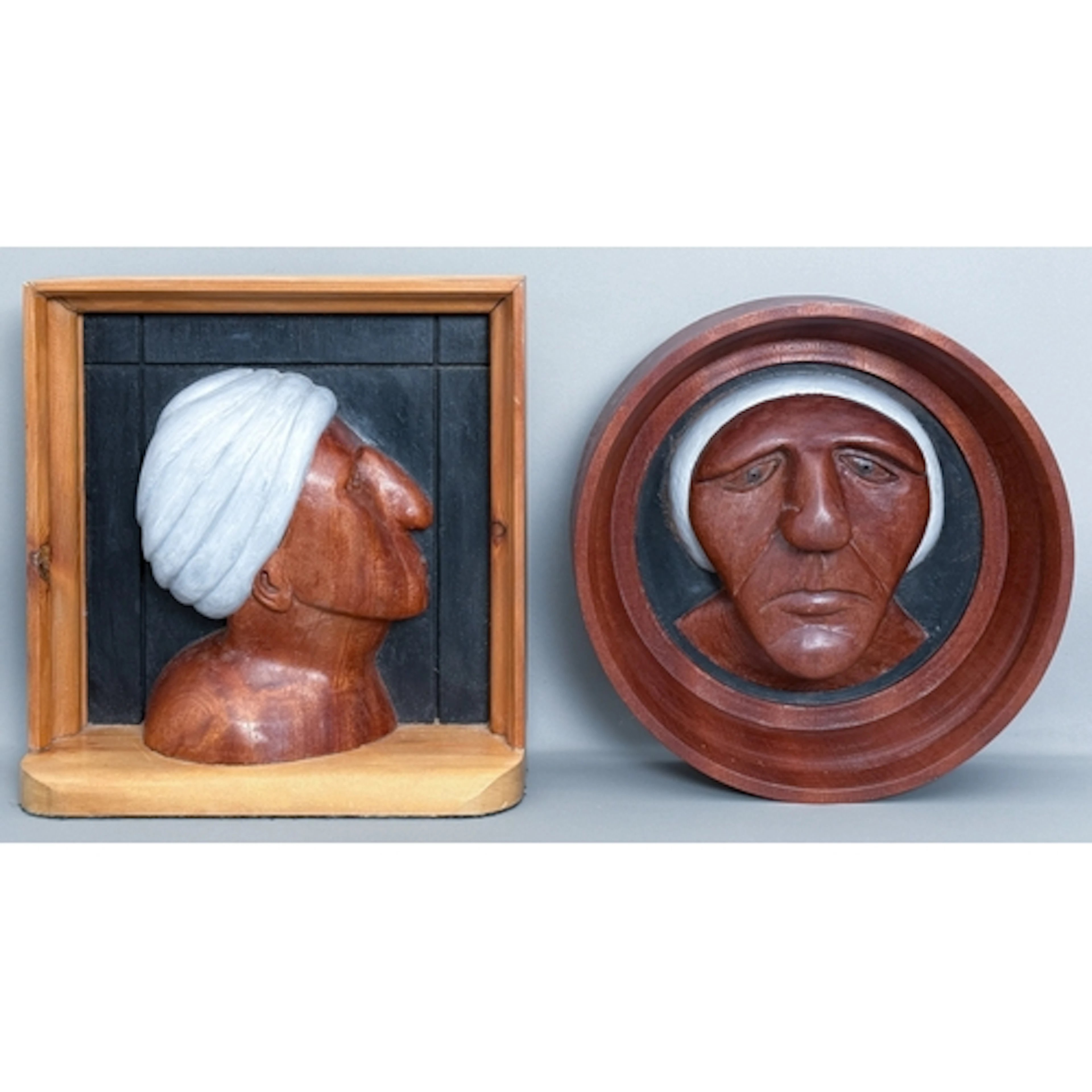 A carved and painted mahogany wood wall hanging sculpture of...