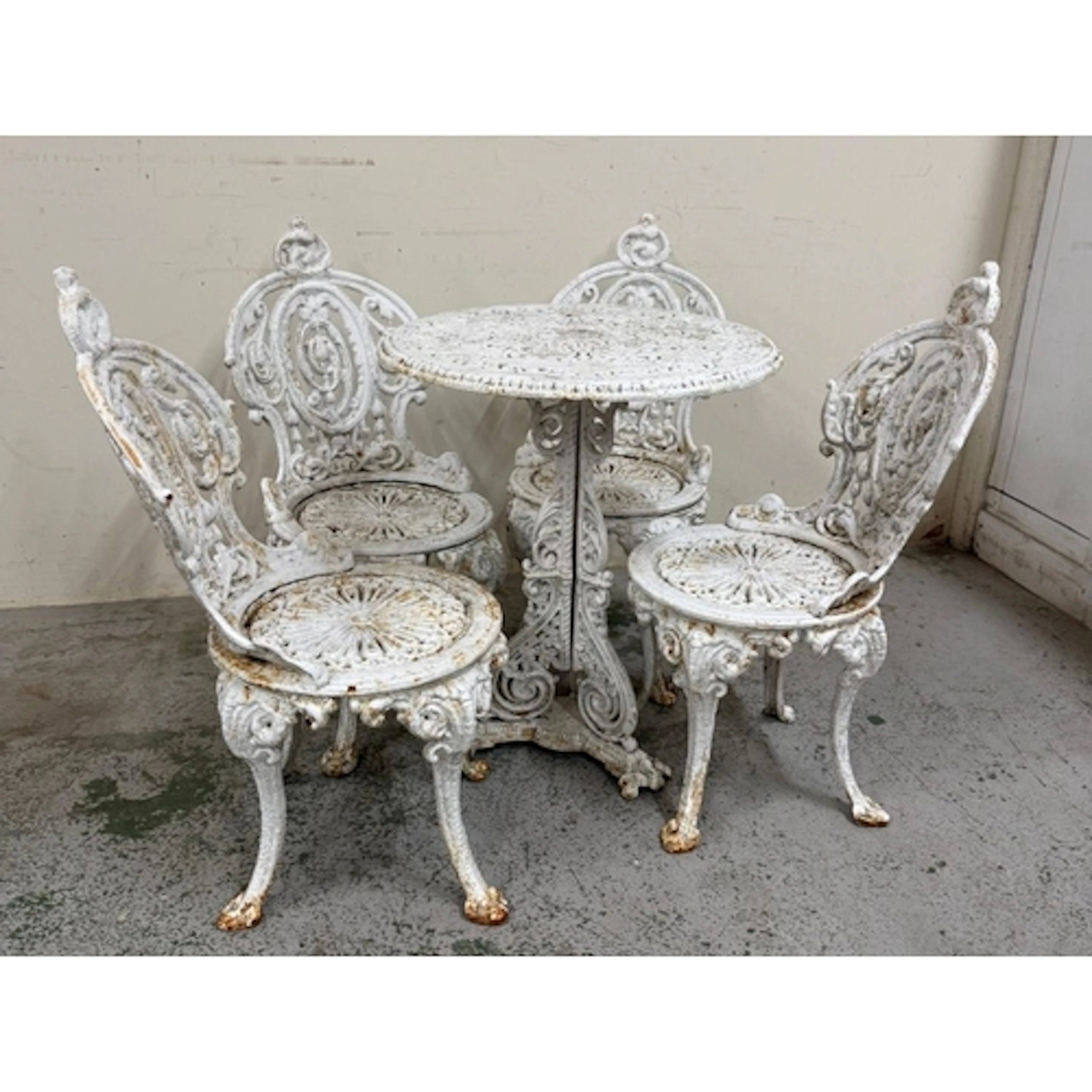 A Victorian white-painted cast-iron garden table in the Coal...