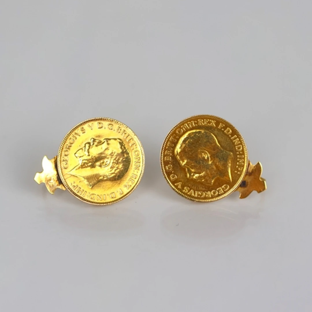 A pair of half sovereign mounted earrings, both coins George...