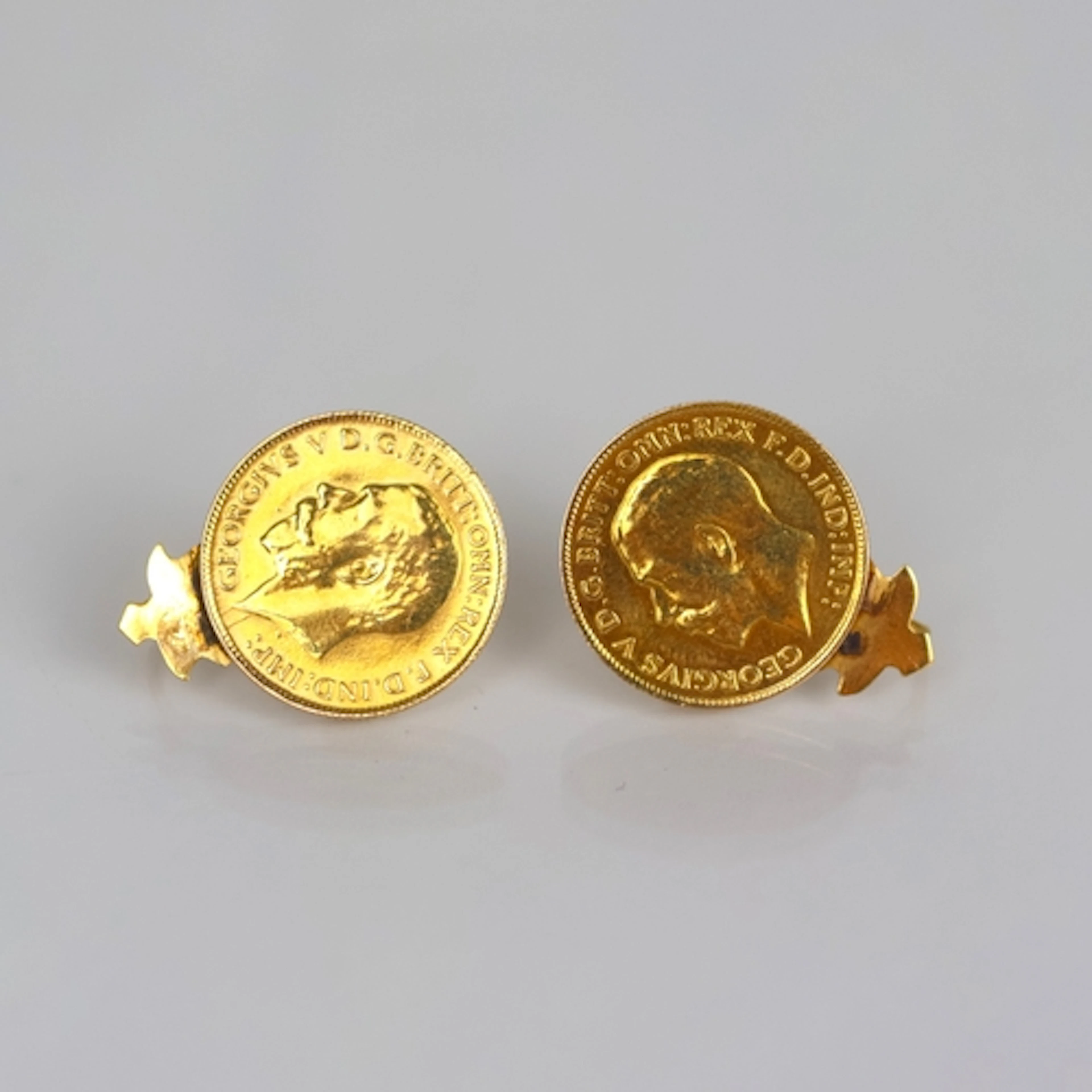 A pair of half sovereign mounted earrings, both coins George...