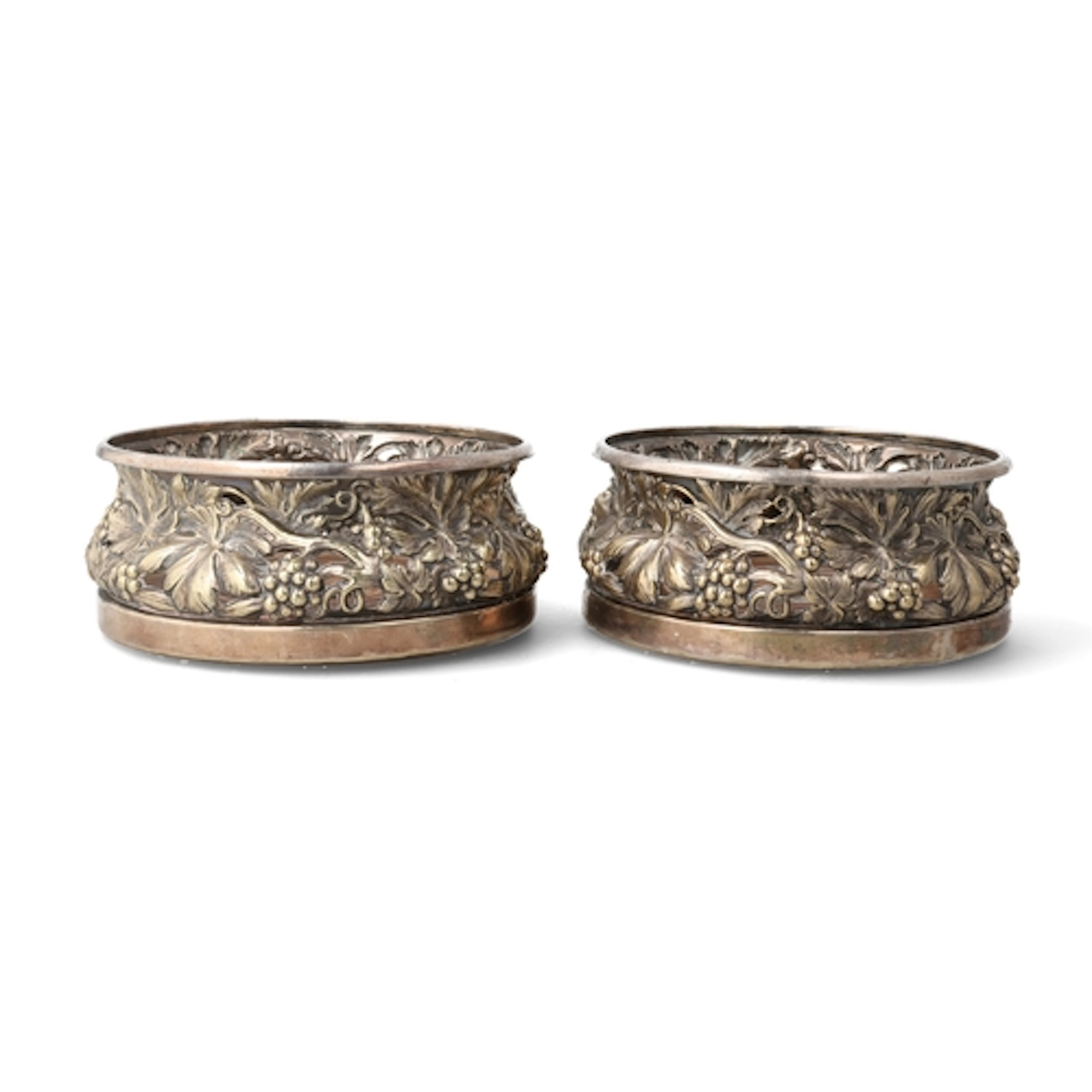 A PAIR OF VICTORIAN SILVER PLATED WINE COASTERS, PIERCED AND...