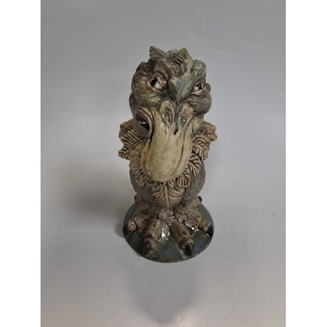 AN EARLY COBRIDGE STONEWARE 'GROTESQUE' NOVELTY JAR AND COVE...