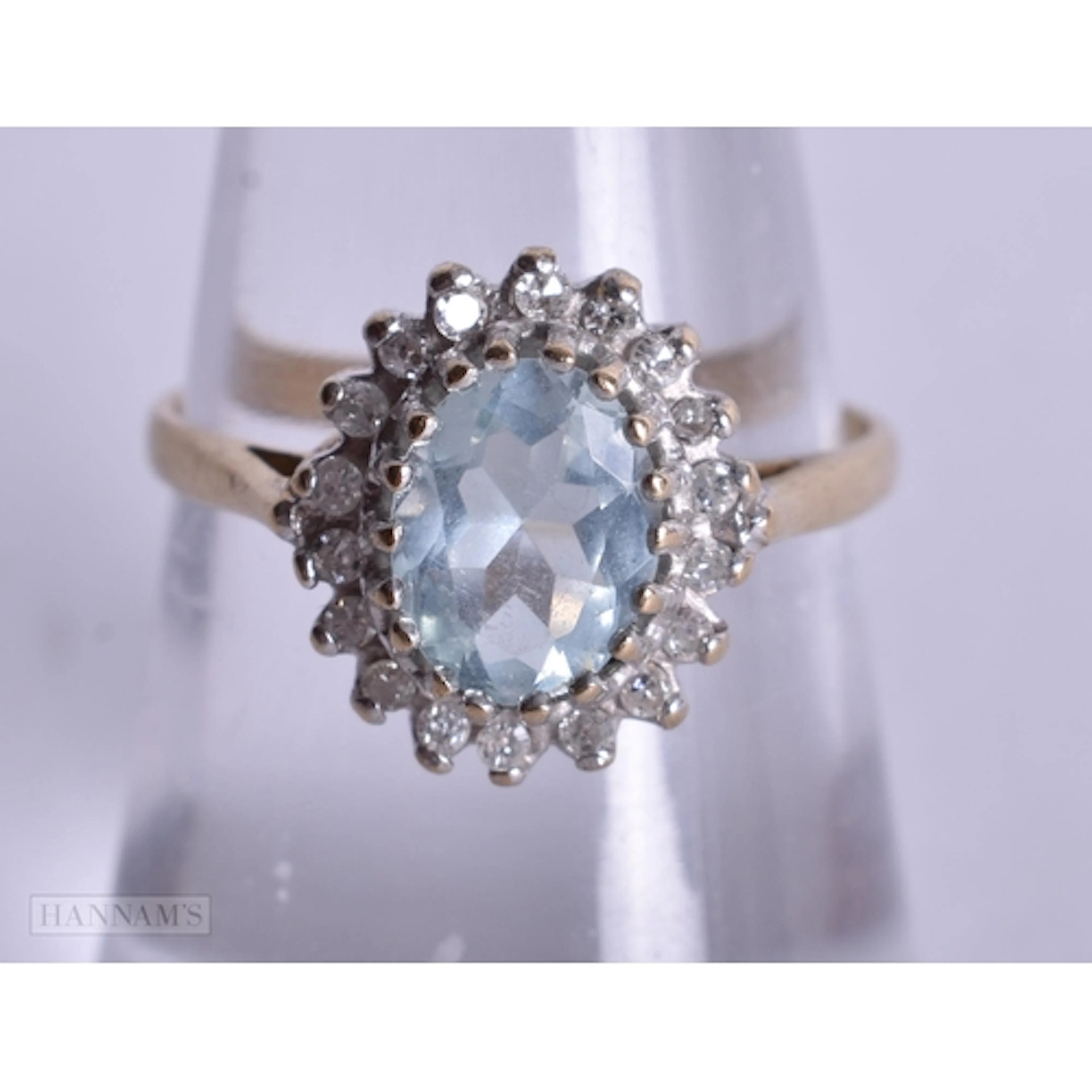 9ct aquamarine and diamond cluster set ring (2.4g). N.