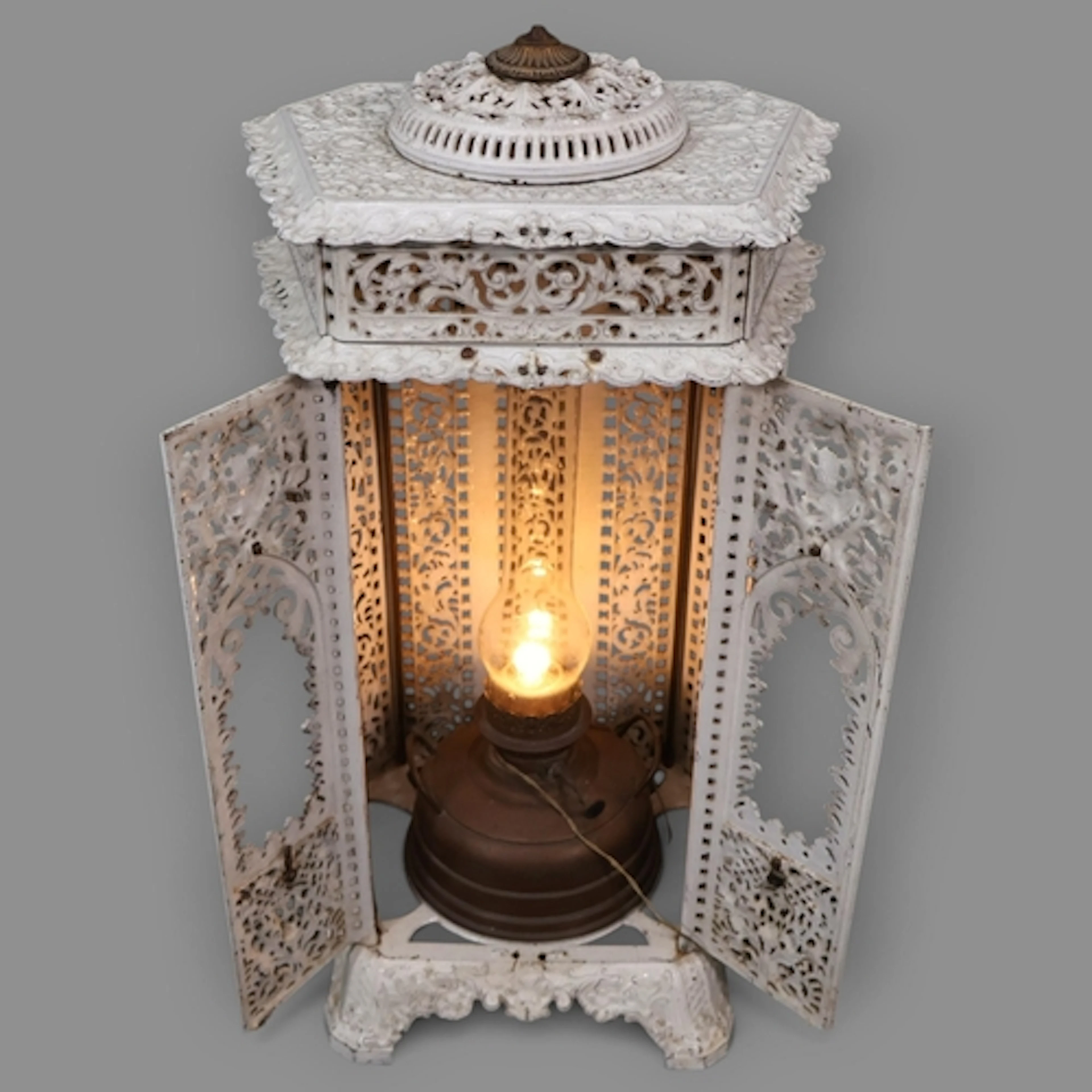 An antique cast iron station station heater, the interior co...