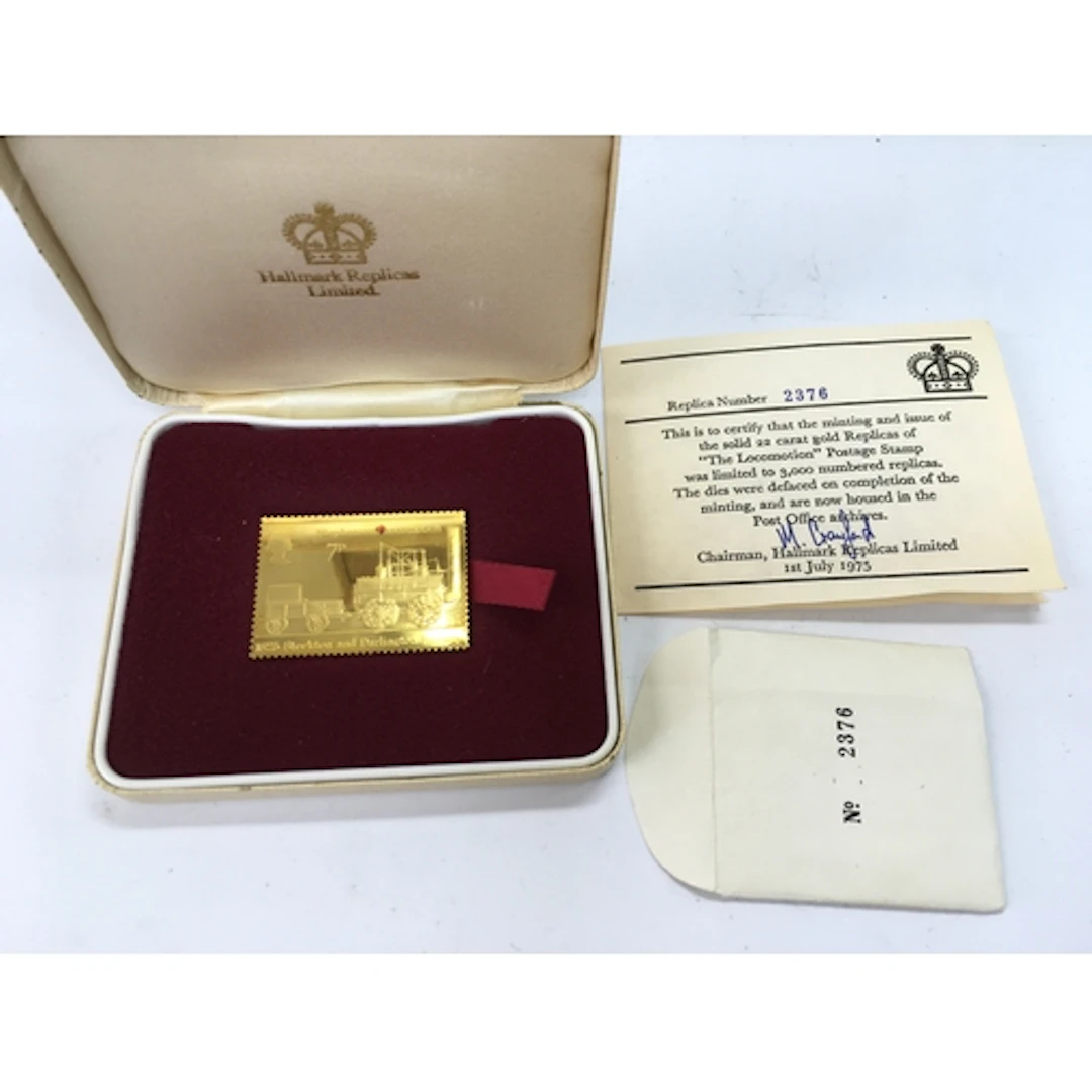 cased 22-carat gold replica of the British 7p "The Locomotio...