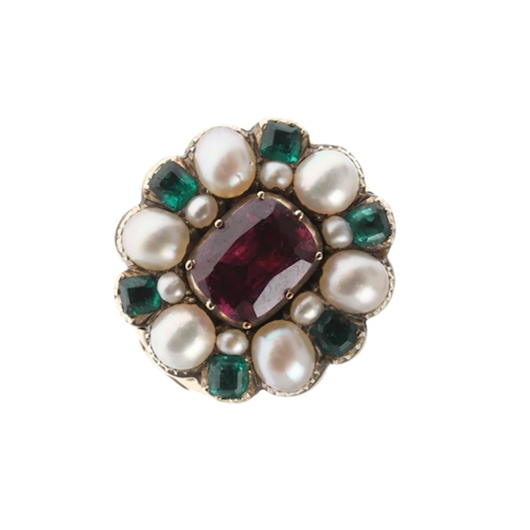 A GEORGIAN GOLD AND GEM SET CLUSTER RING. the oval-shaped fo...