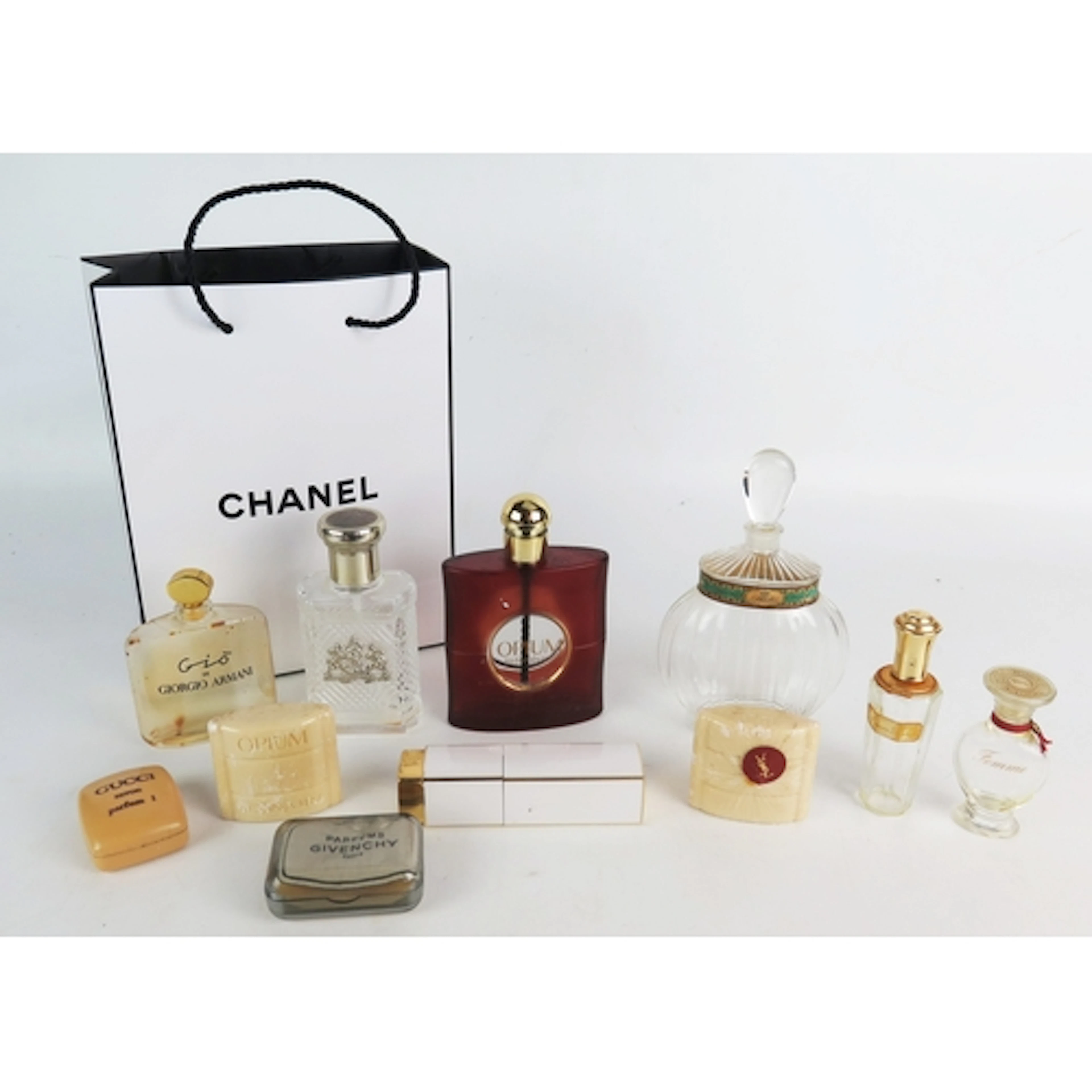 A collection of assorted scent bottles and soaps contained i...