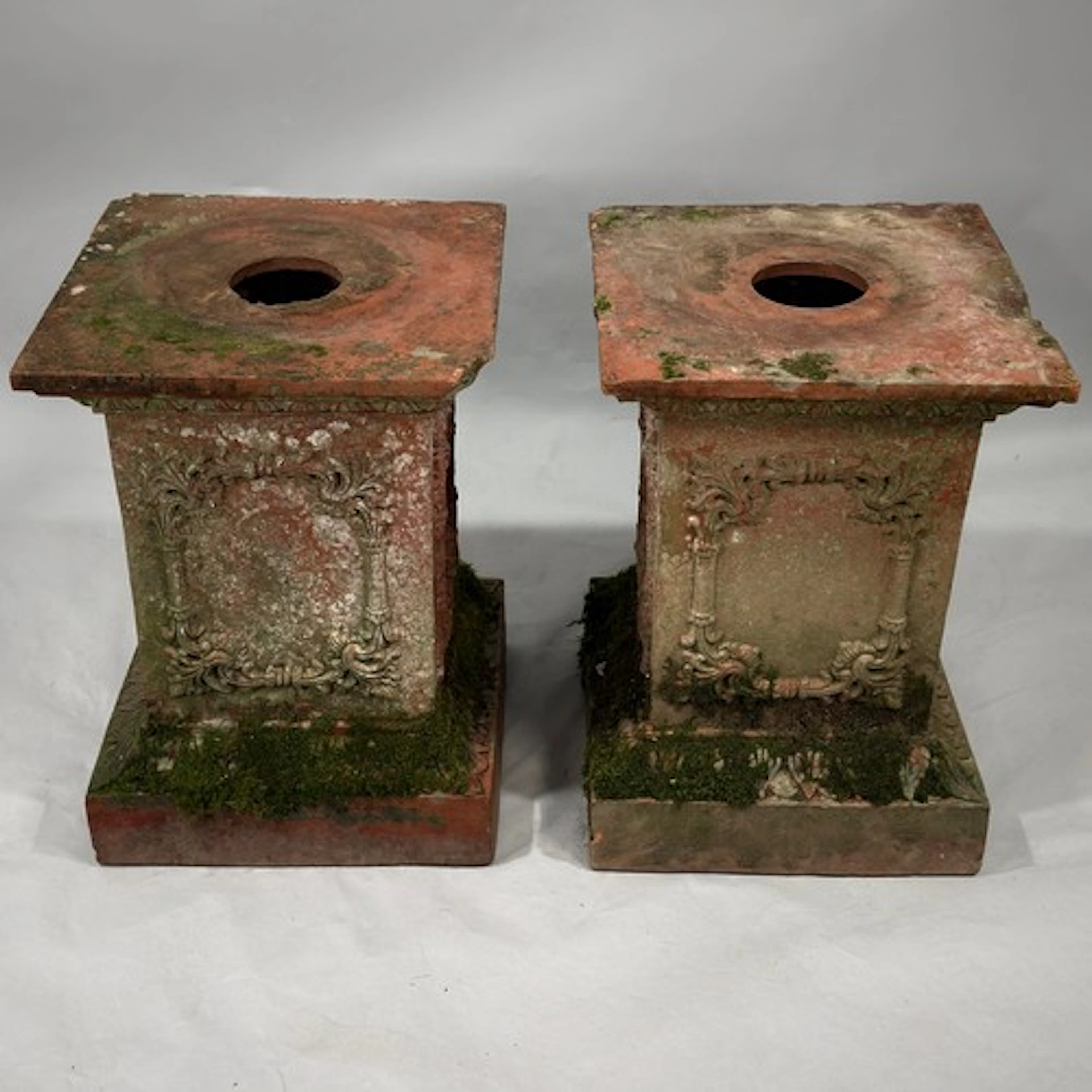 A pair of weathered terracotta garden Plinths, by W M Thomas...