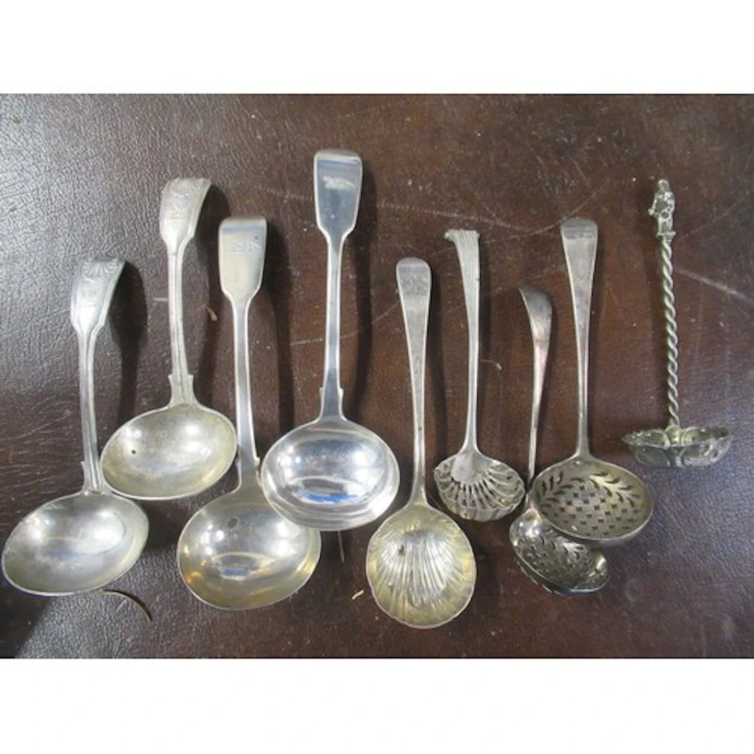 Two pairs of silver sauce ladles, together with another sauc...