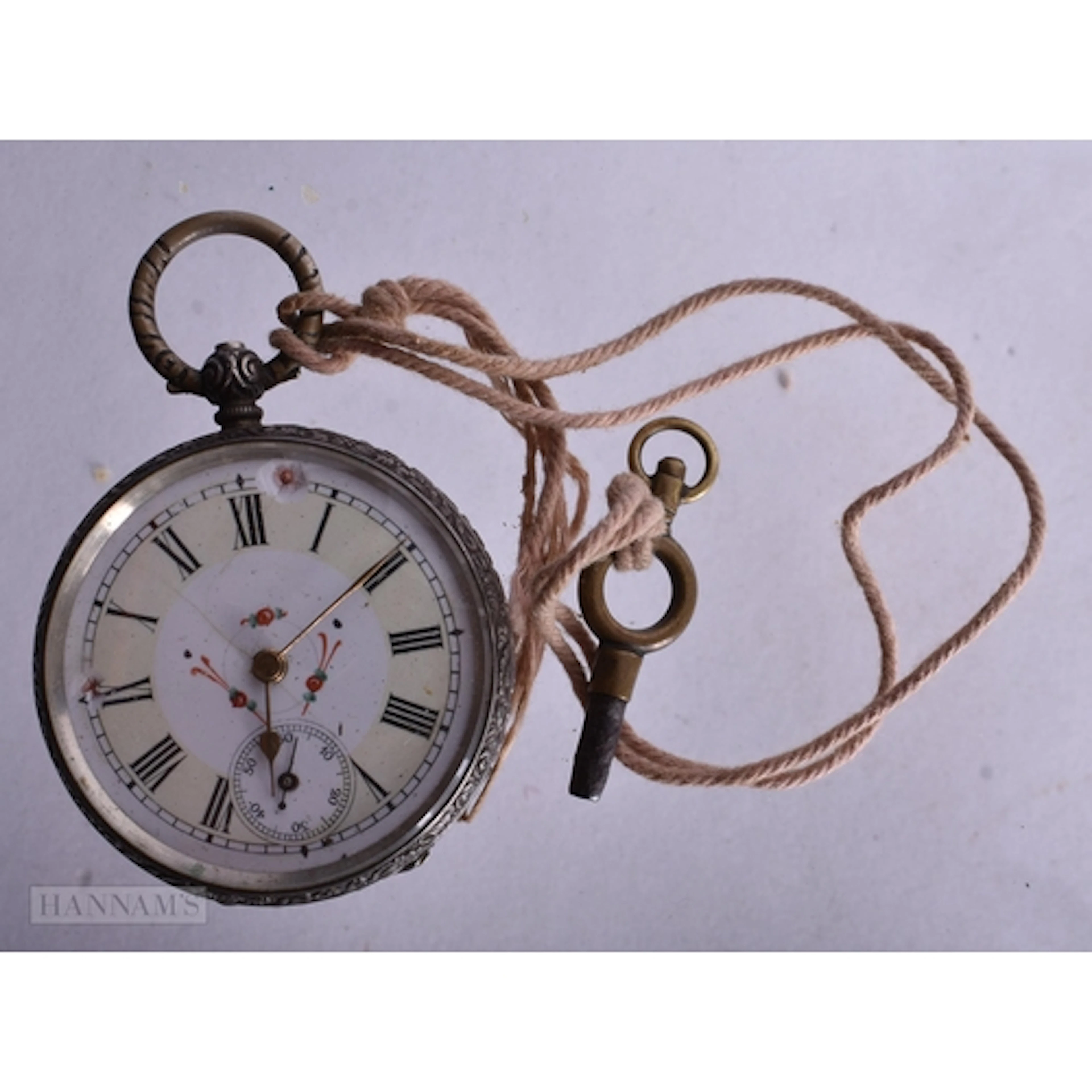 A Continental Silver Cased Open Face Pocket Watch with Key. ...