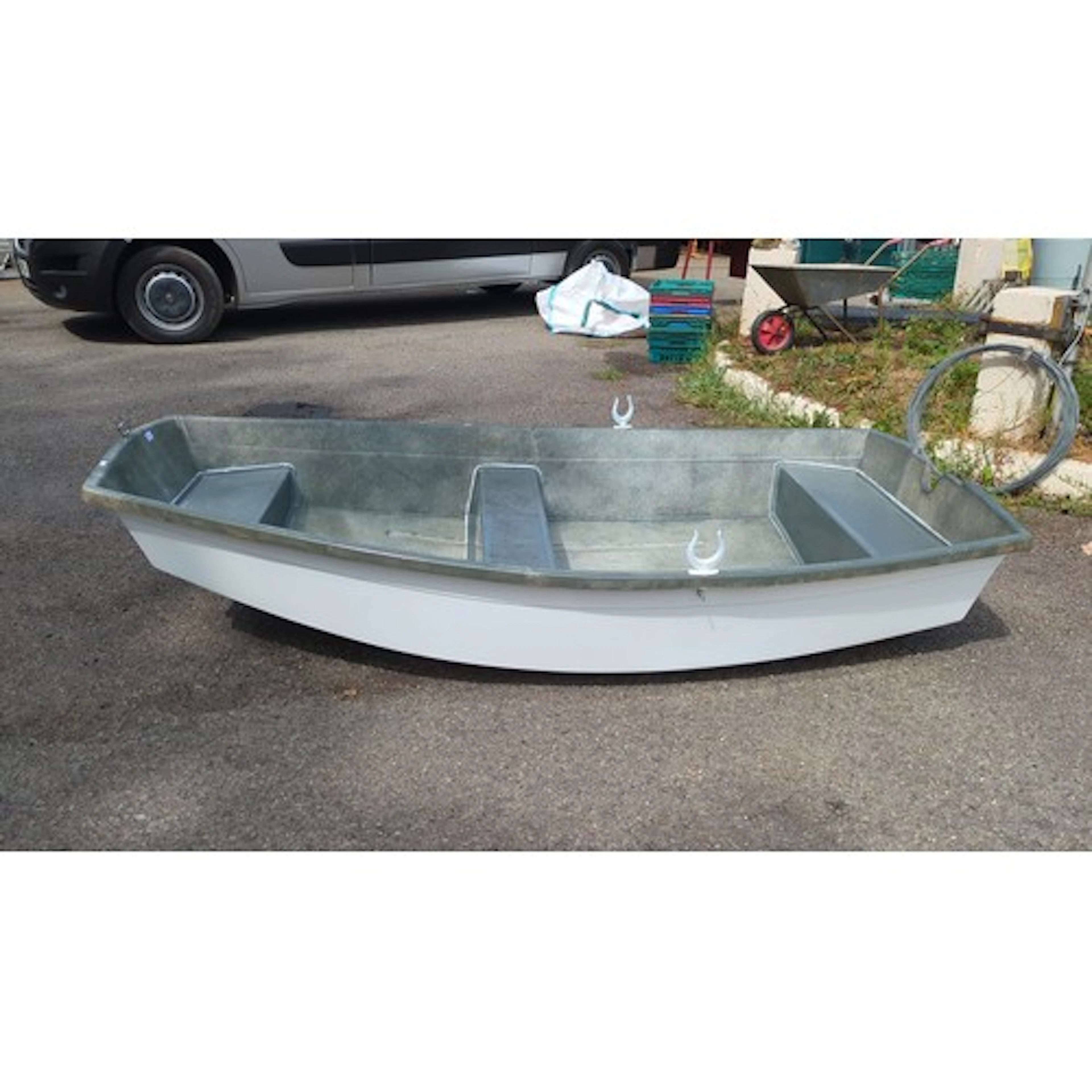 Small moulded fiberglass dinghy of open form, with grey inte...