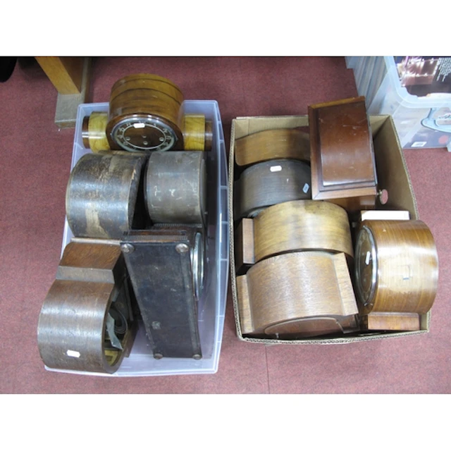 Collection of vintage wooden mantel clocks in various Art De...