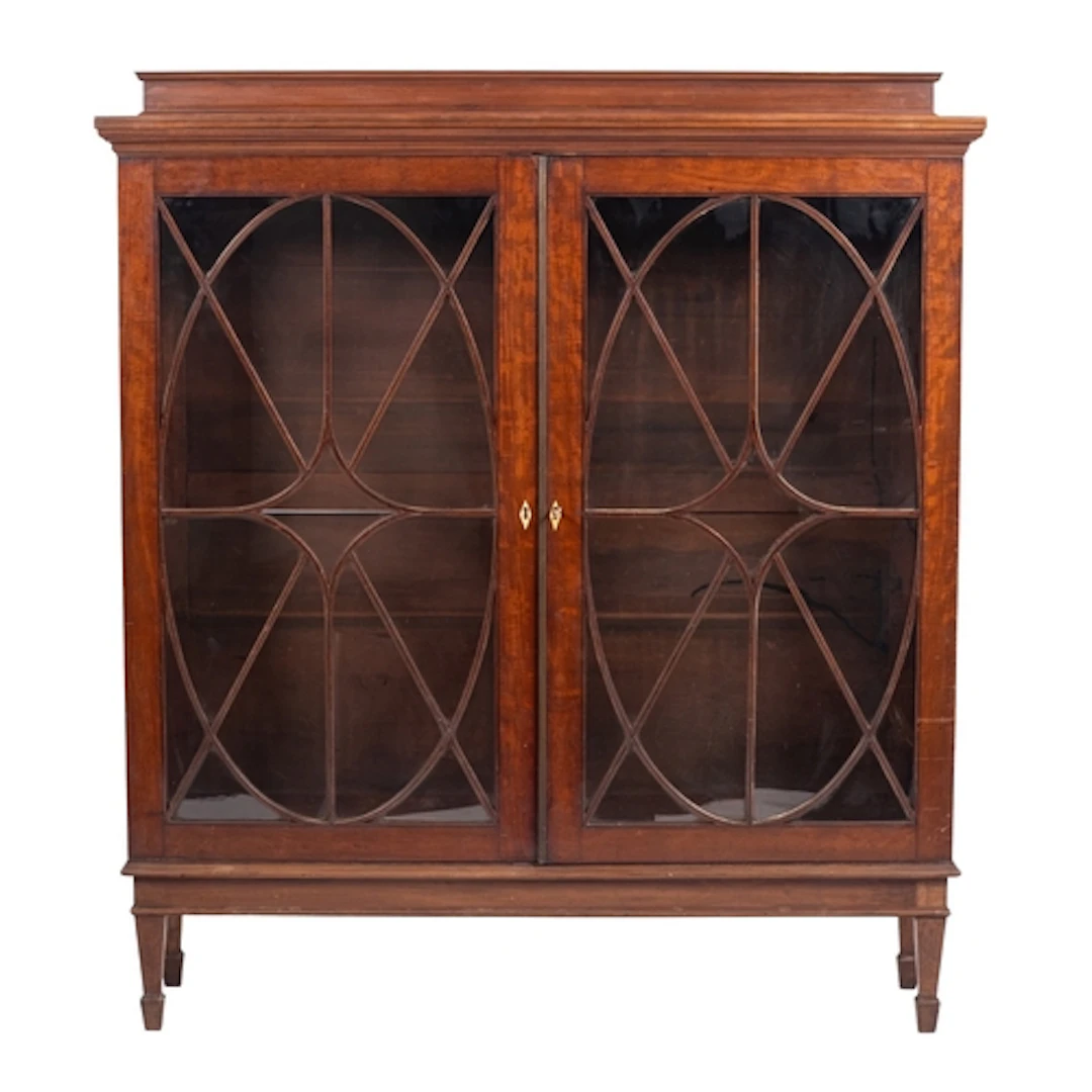 A mahogany and glazed bookcase in Regency taste, circa 1900;...