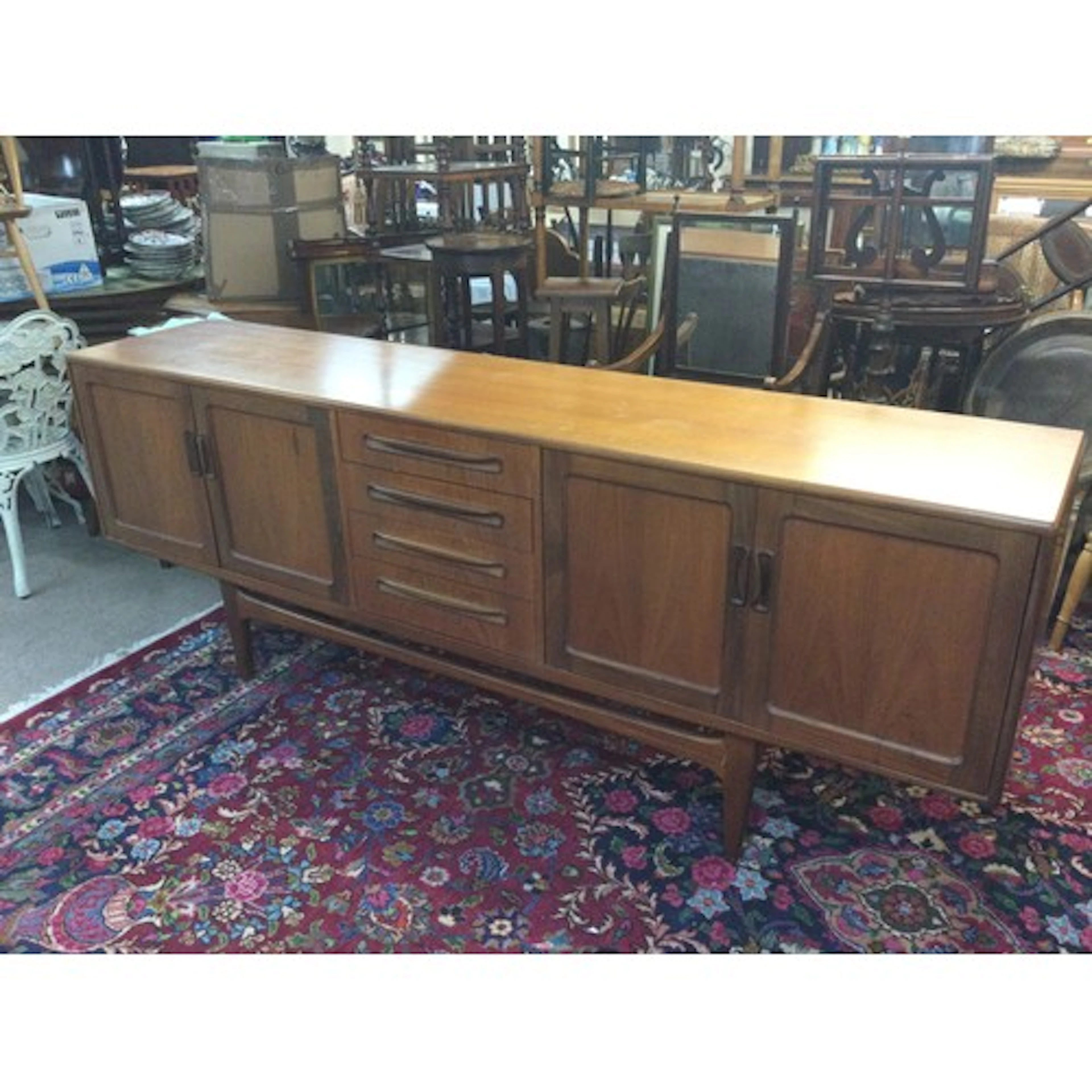 A mid-century modern "Long John" teak sideboard. 46cm long 2...