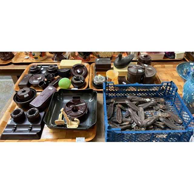 Three trays of assorted Bakelite items to include: ashtrays,...