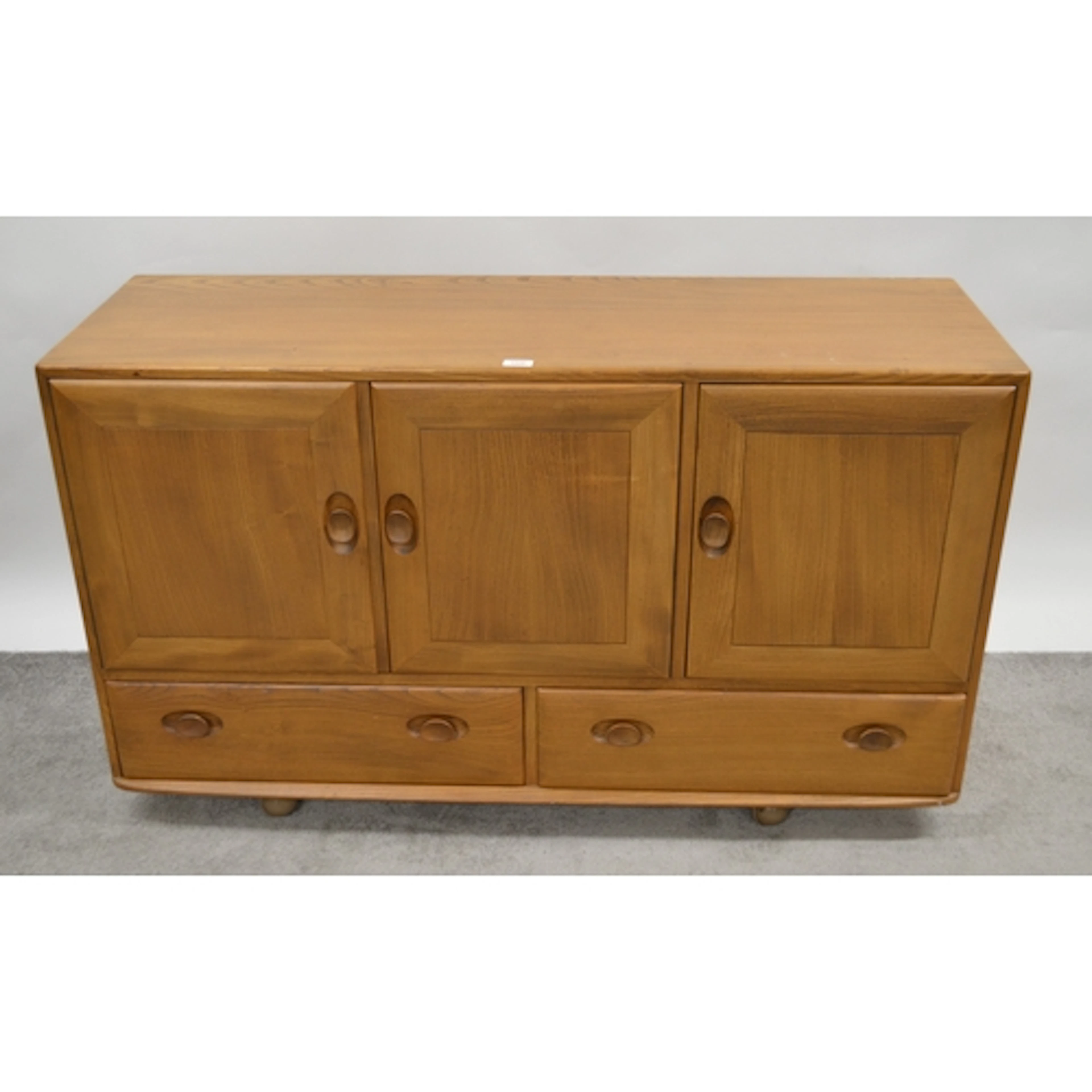 Mid Century Ercol three door sideboard, 130cm wide