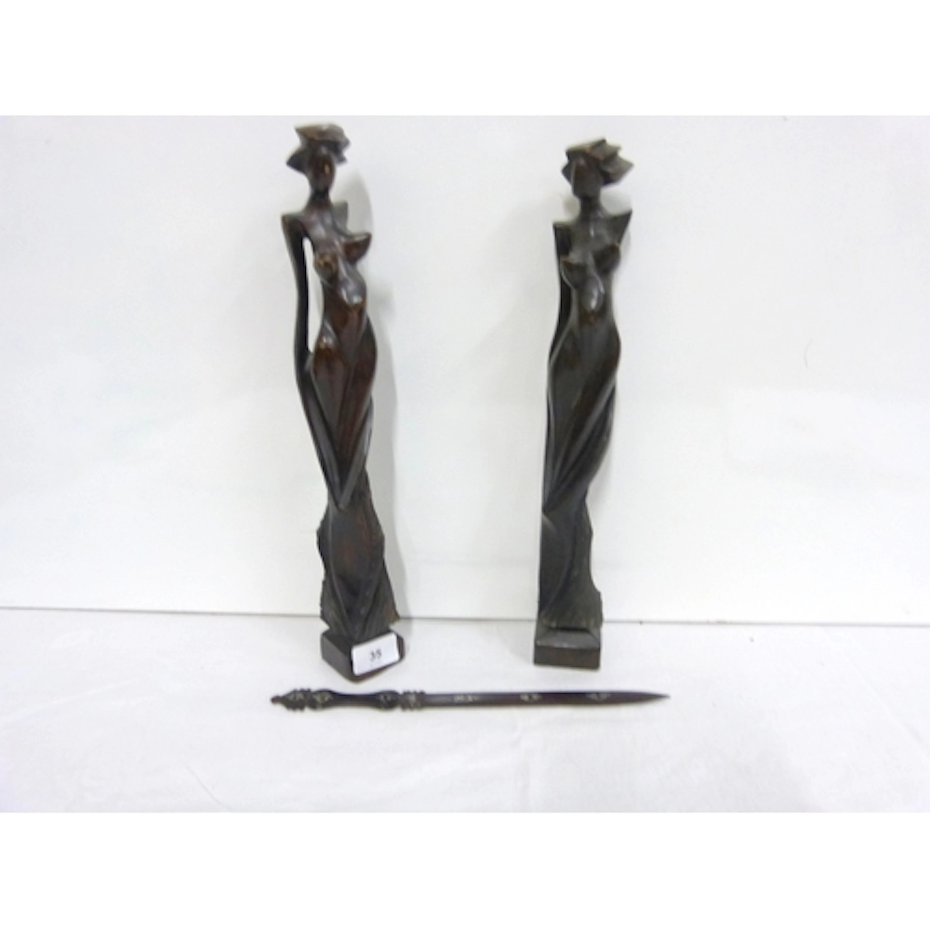 Two hand carved Art Deco figures 38cm and an inlaid letter o...
