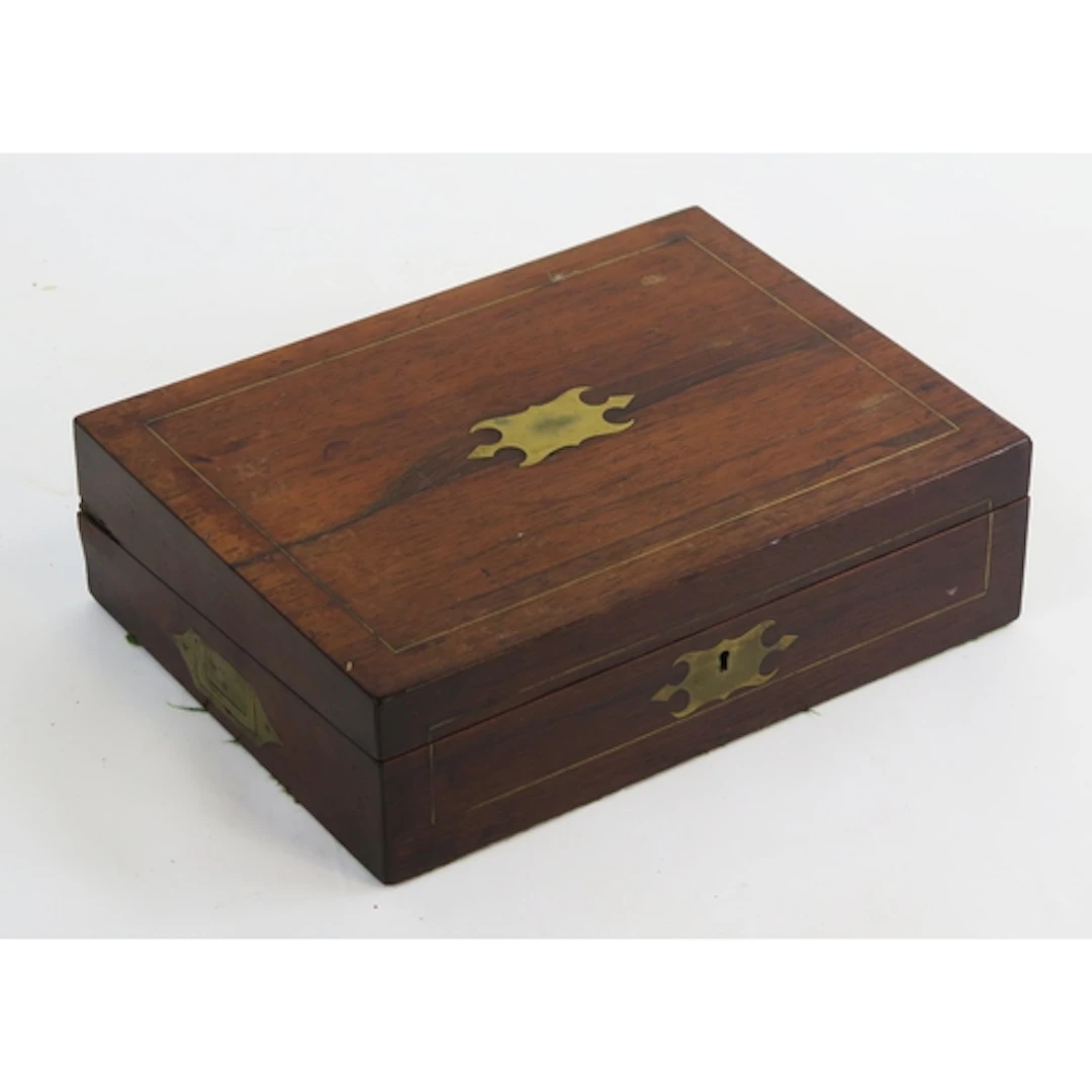 A 19th century rosewood writing slope, the hinged lid enclos...