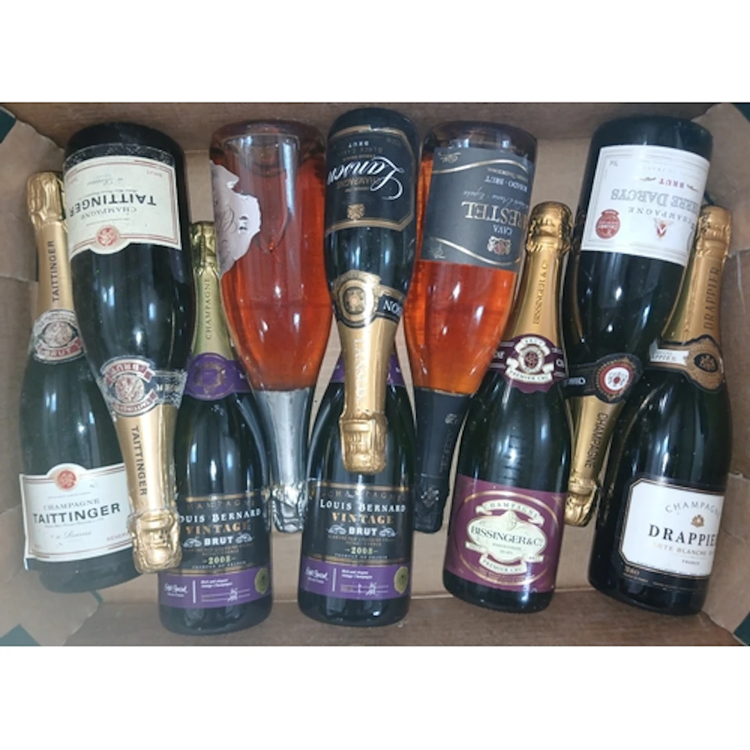 Nine bottles of assorted sparkling wine.