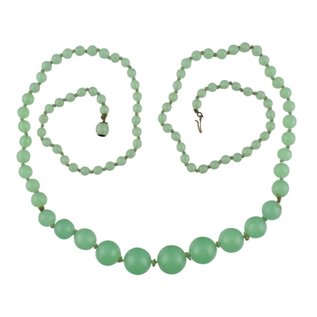 A vintage uranium glass bead necklace. The necklace with gra...