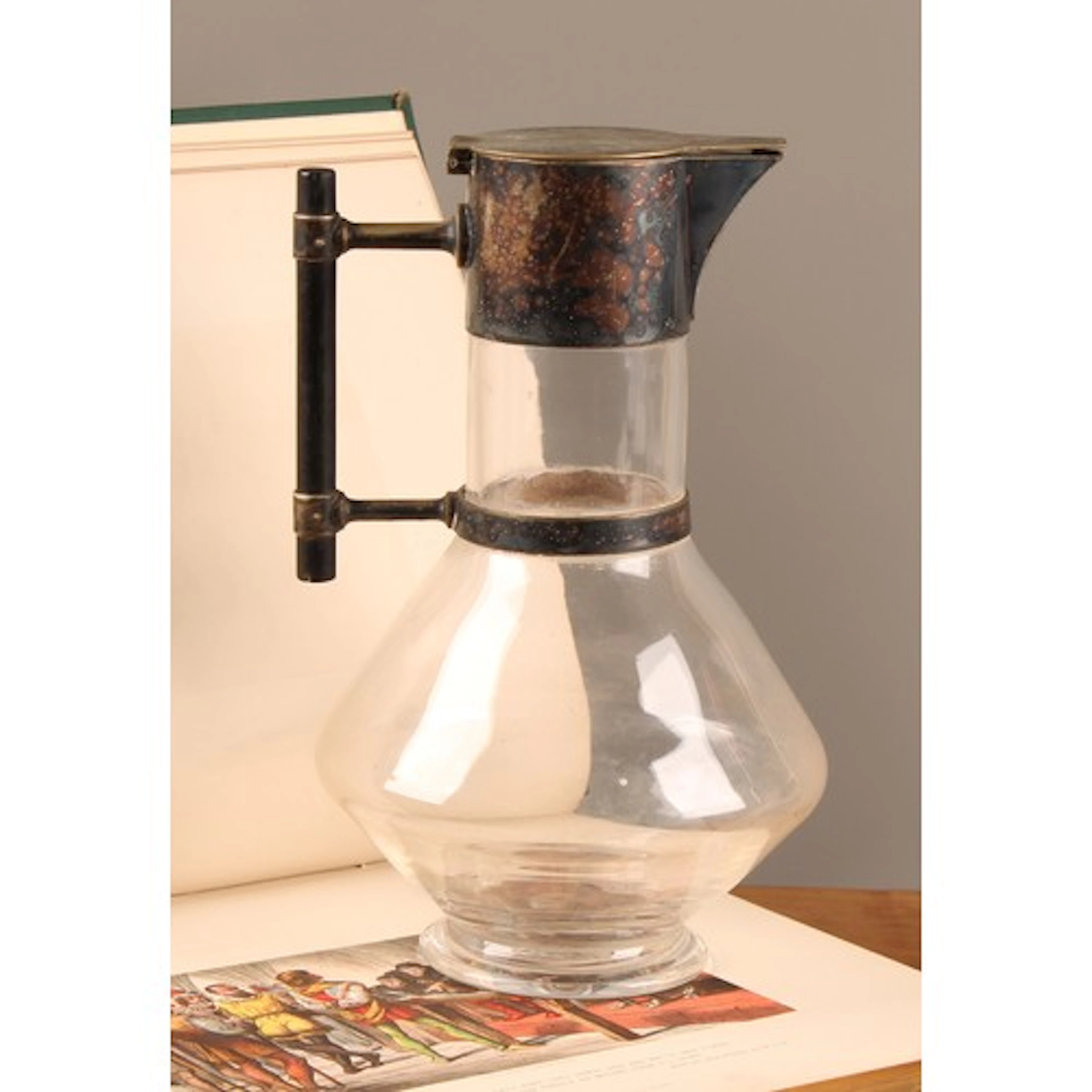 A Victorian E.P.N.S mounted claret jug, designed by Dr Chris...