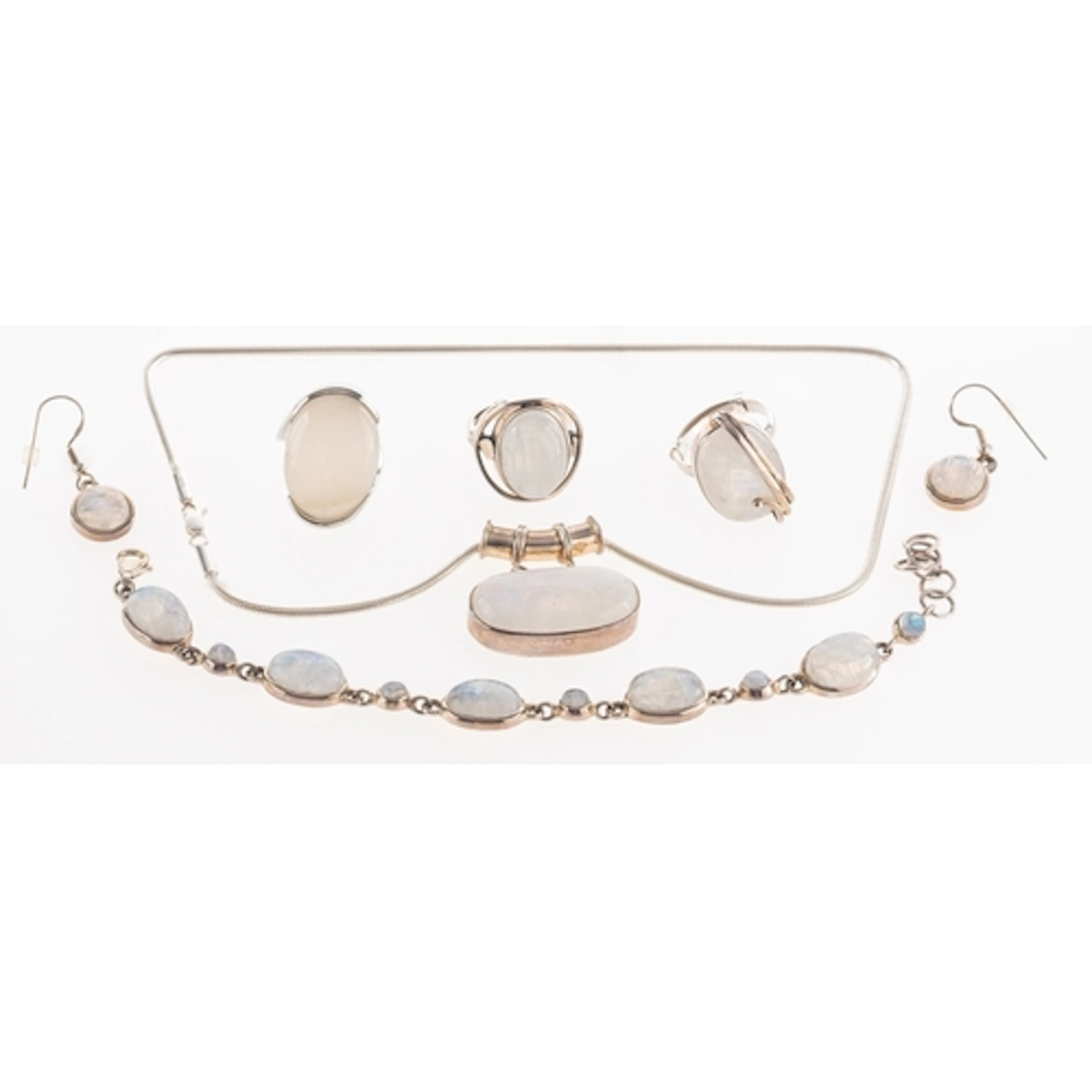 Two white metal and gemstone jewellery sets, consisting of a...