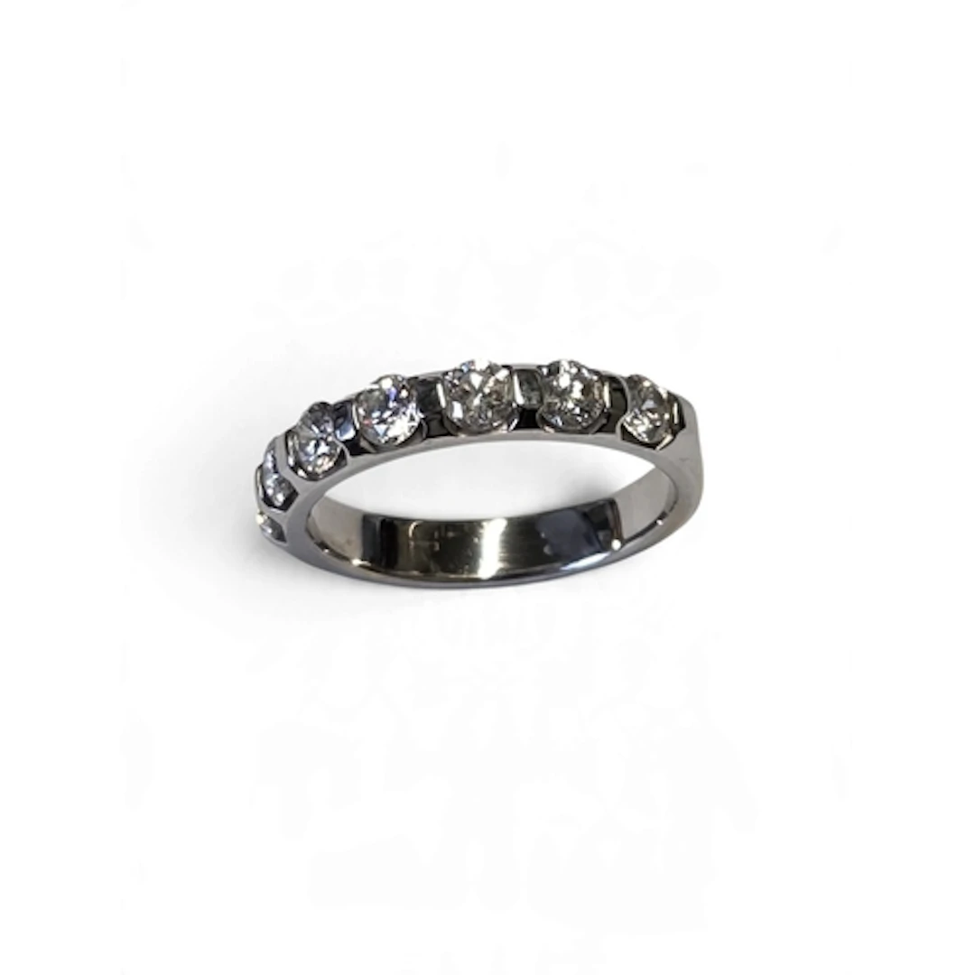 A superb 18-carat white gold seven-stone diamond half eterni...