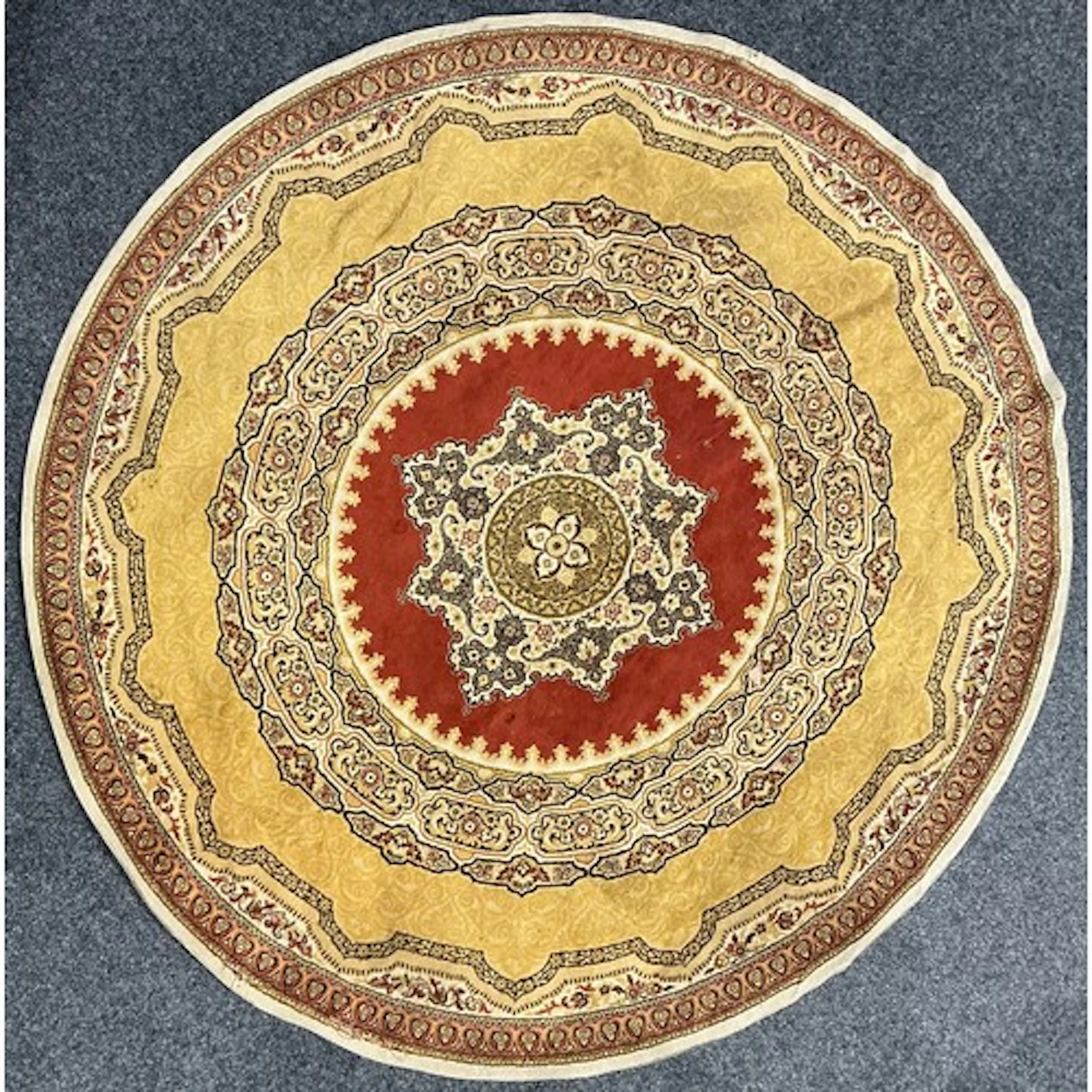 A Persian design circular wool rug or carpet, 243cm diameter