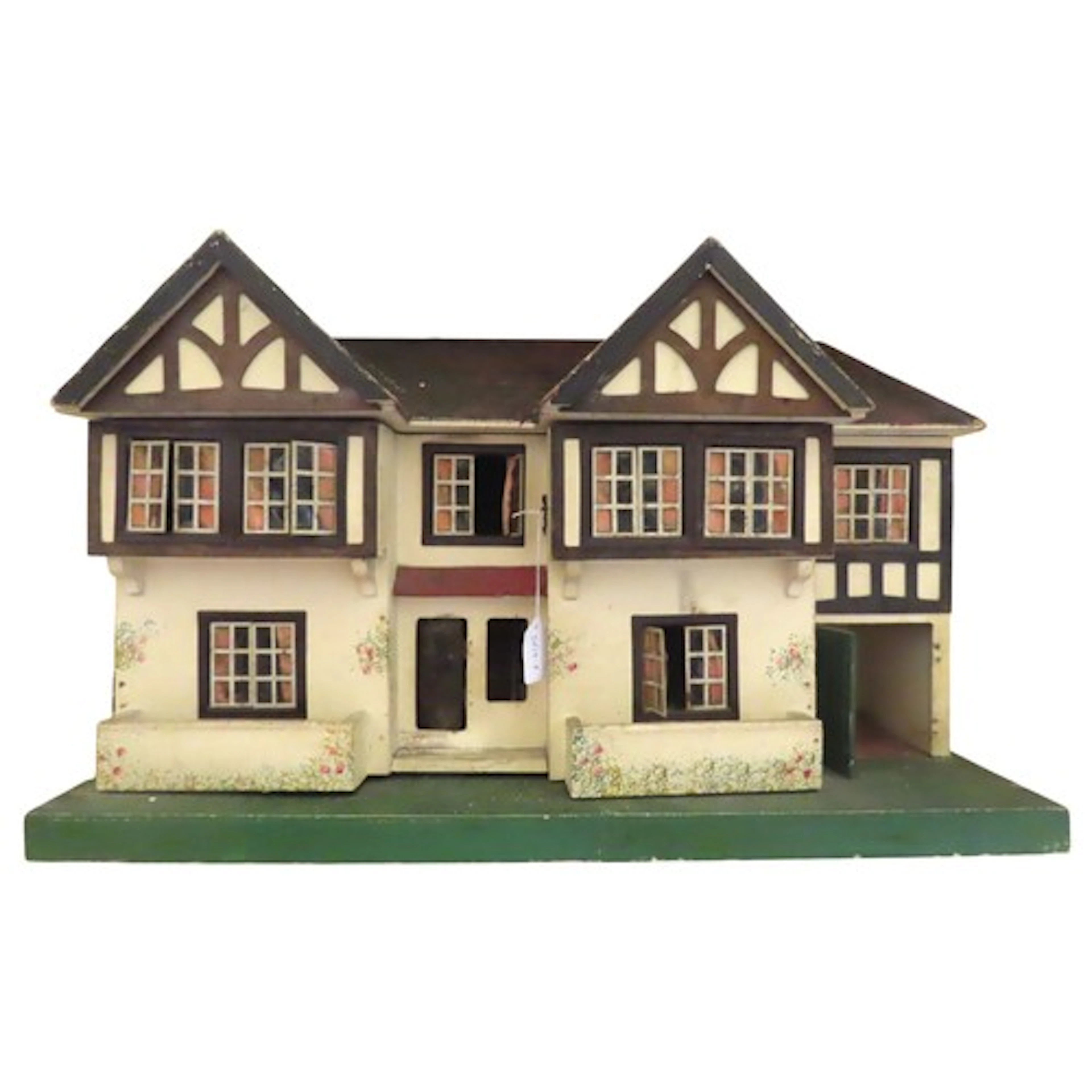 A vintage suburban Gothic style four bedroom dolls house, wi...