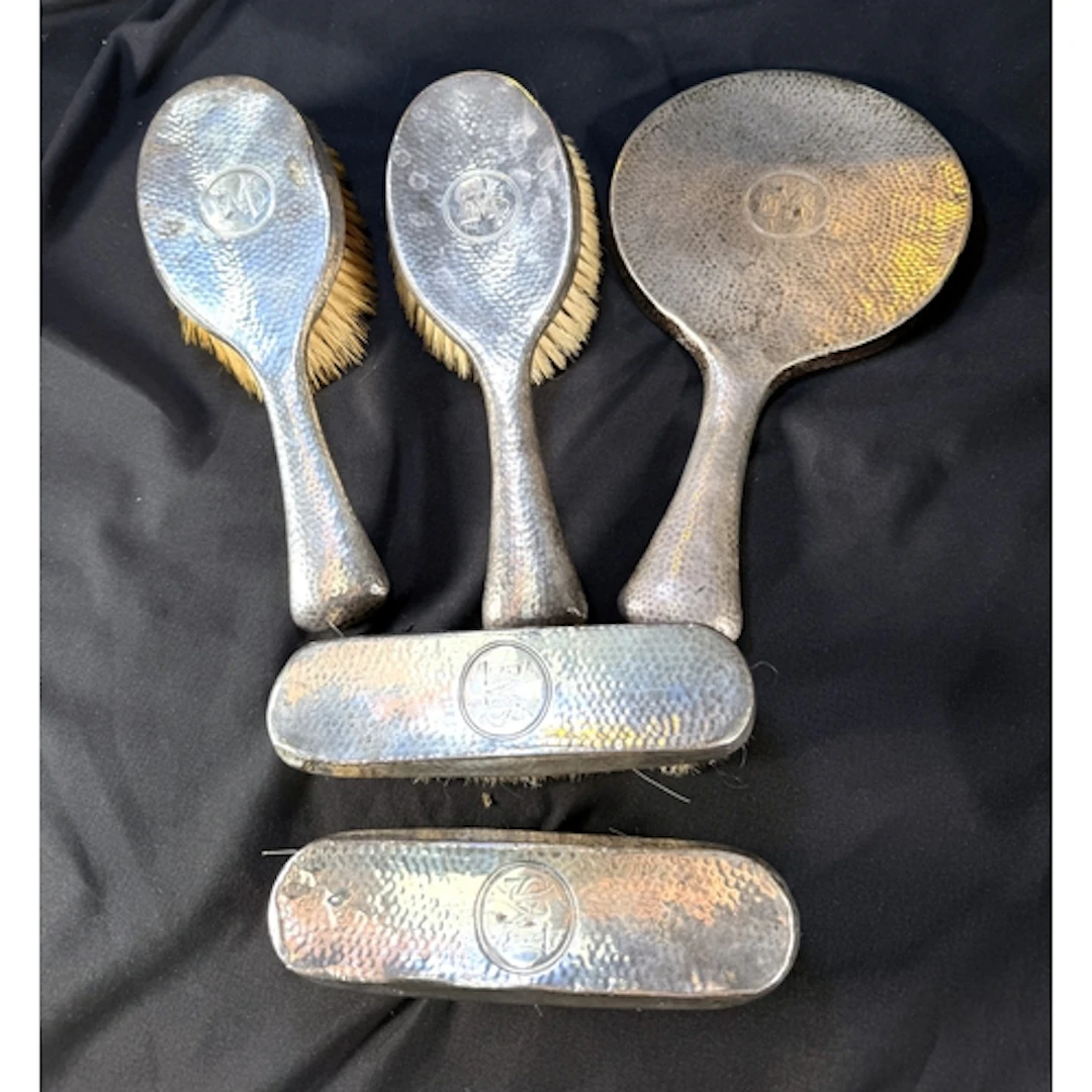A heavy hall marked silver monogrammed and planished four pi...