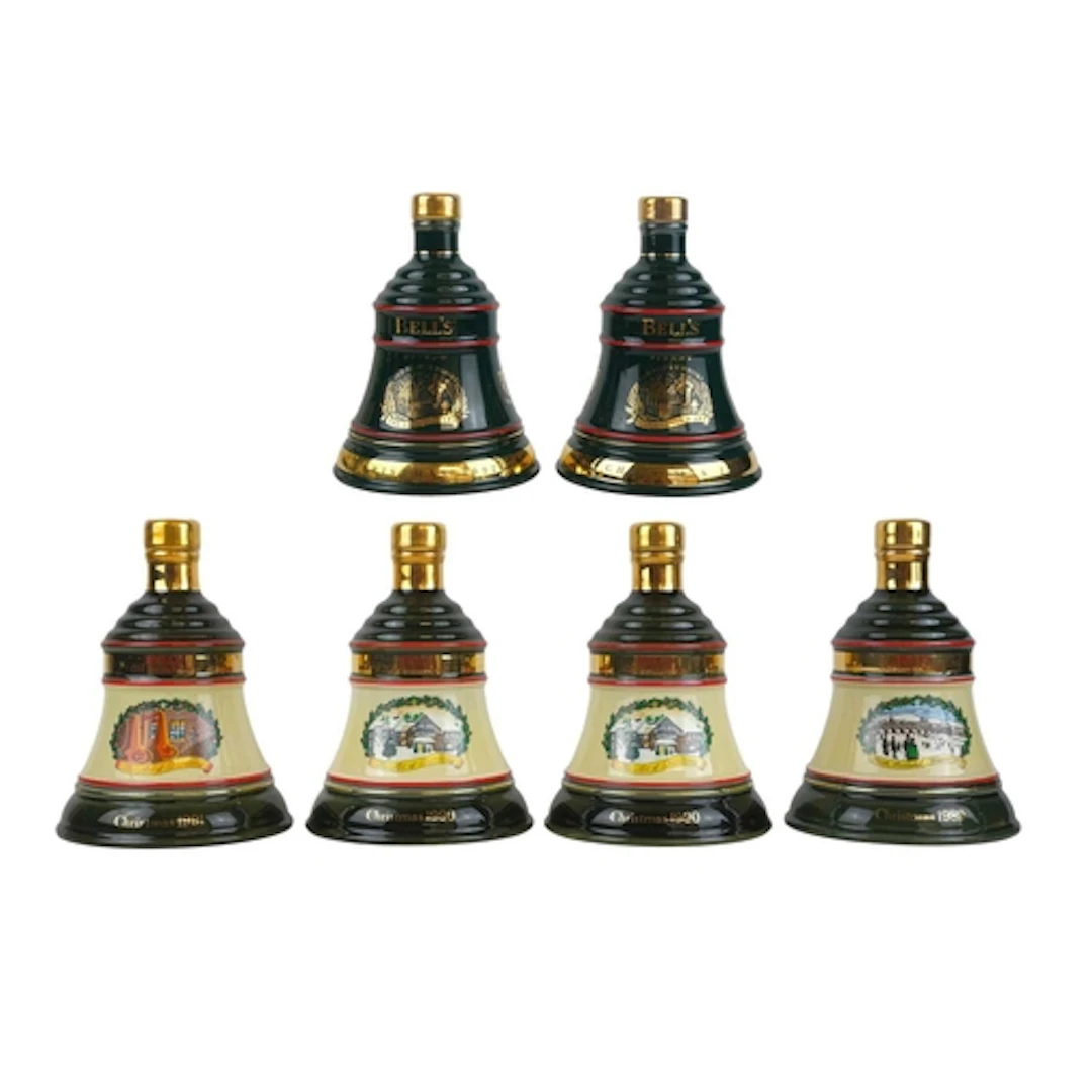 Six sealed Bell's Scotch Whisky decanters. Each in a cardboa...
