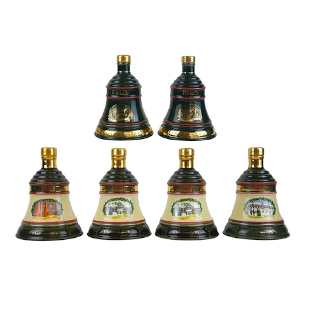 Six sealed Bell's Scotch Whisky decanters. Each in a cardboa...