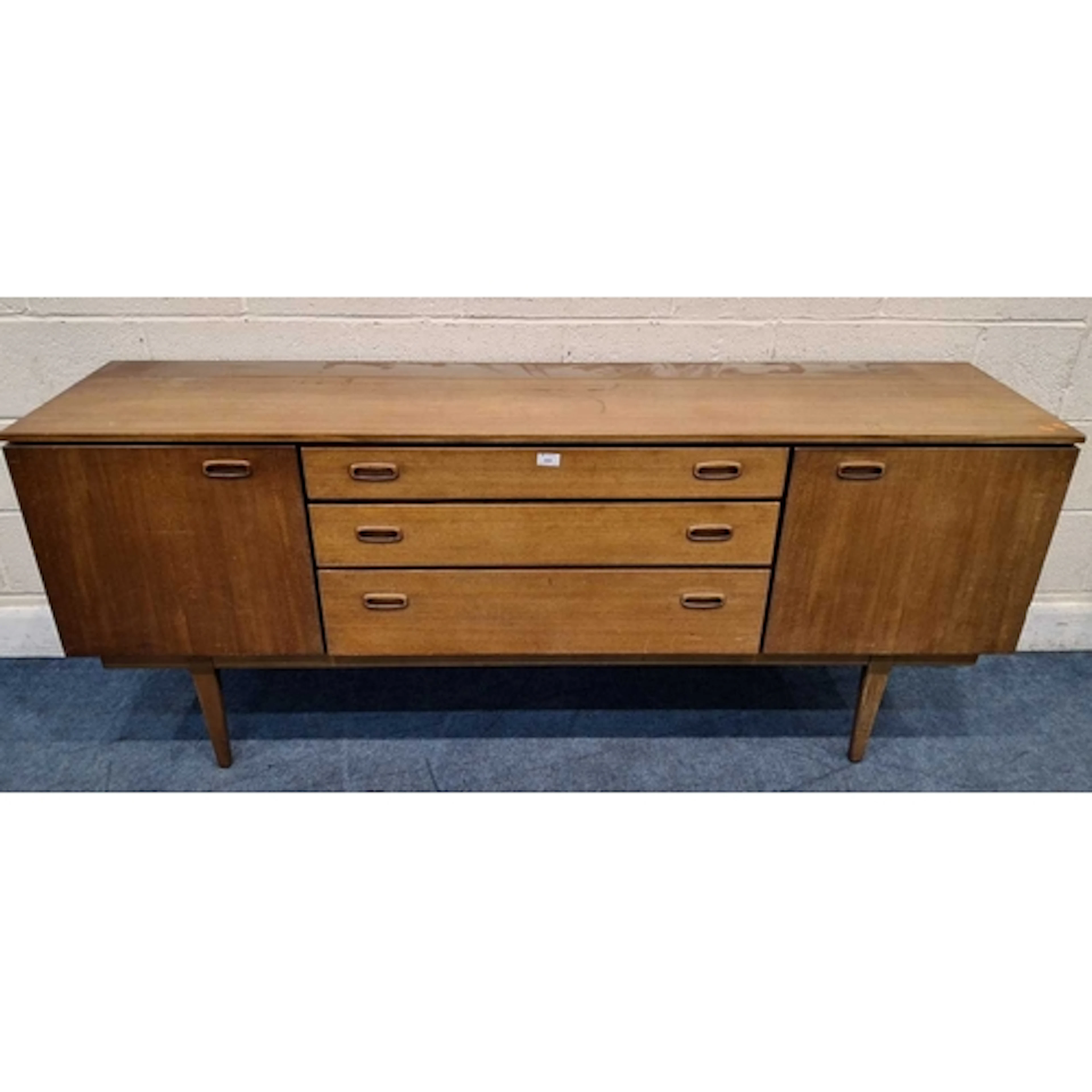 A NATHAN MID-CENTURY TEAK SIDEBOARD, fitted with two cupboar...