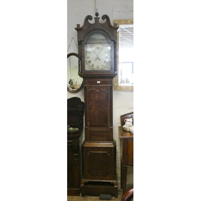A Victorian thirty hour Grandfather clock in oak and mahogan...