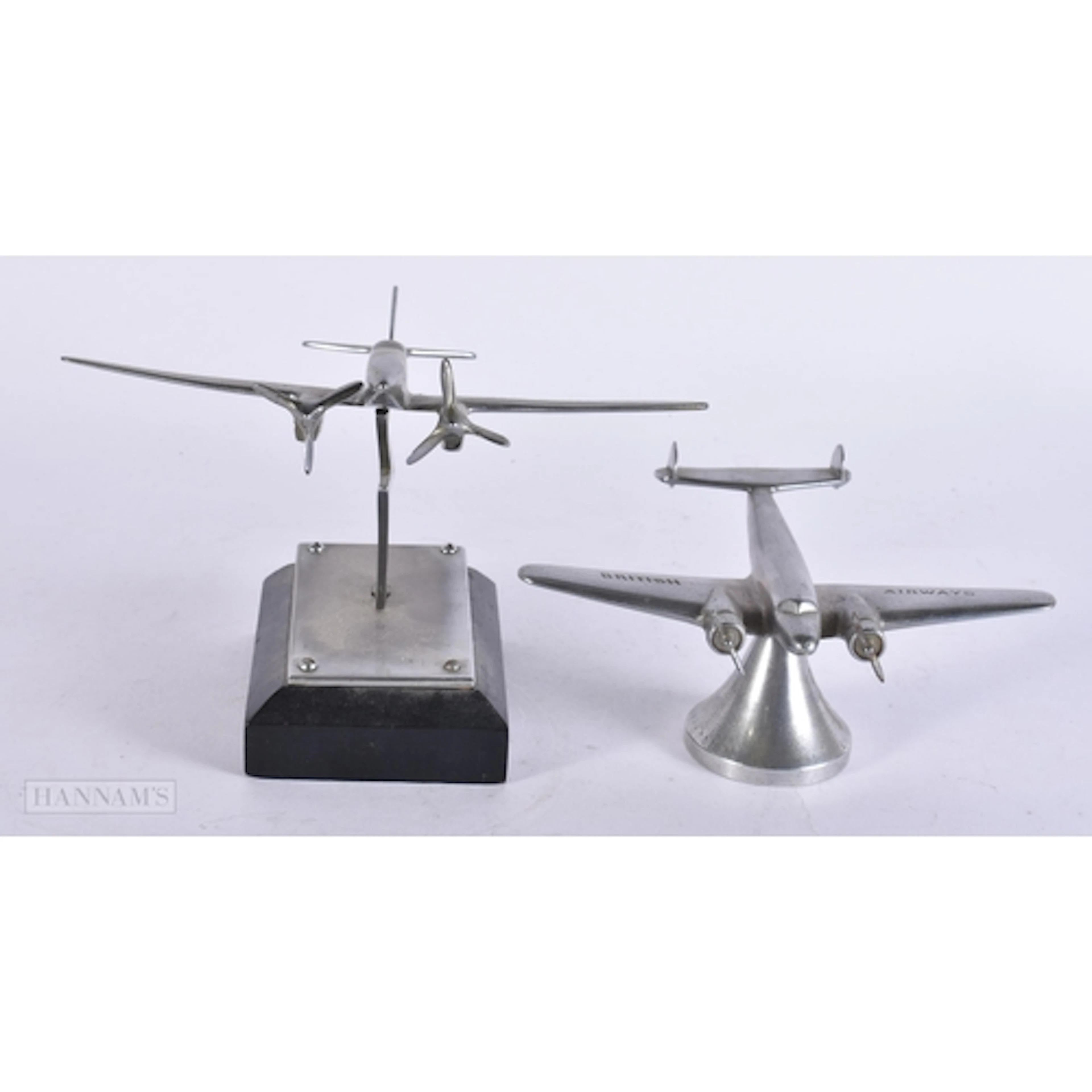 TWO MILITARY INTEREST AERONAUTICAL CAR MASCOTS. (2)