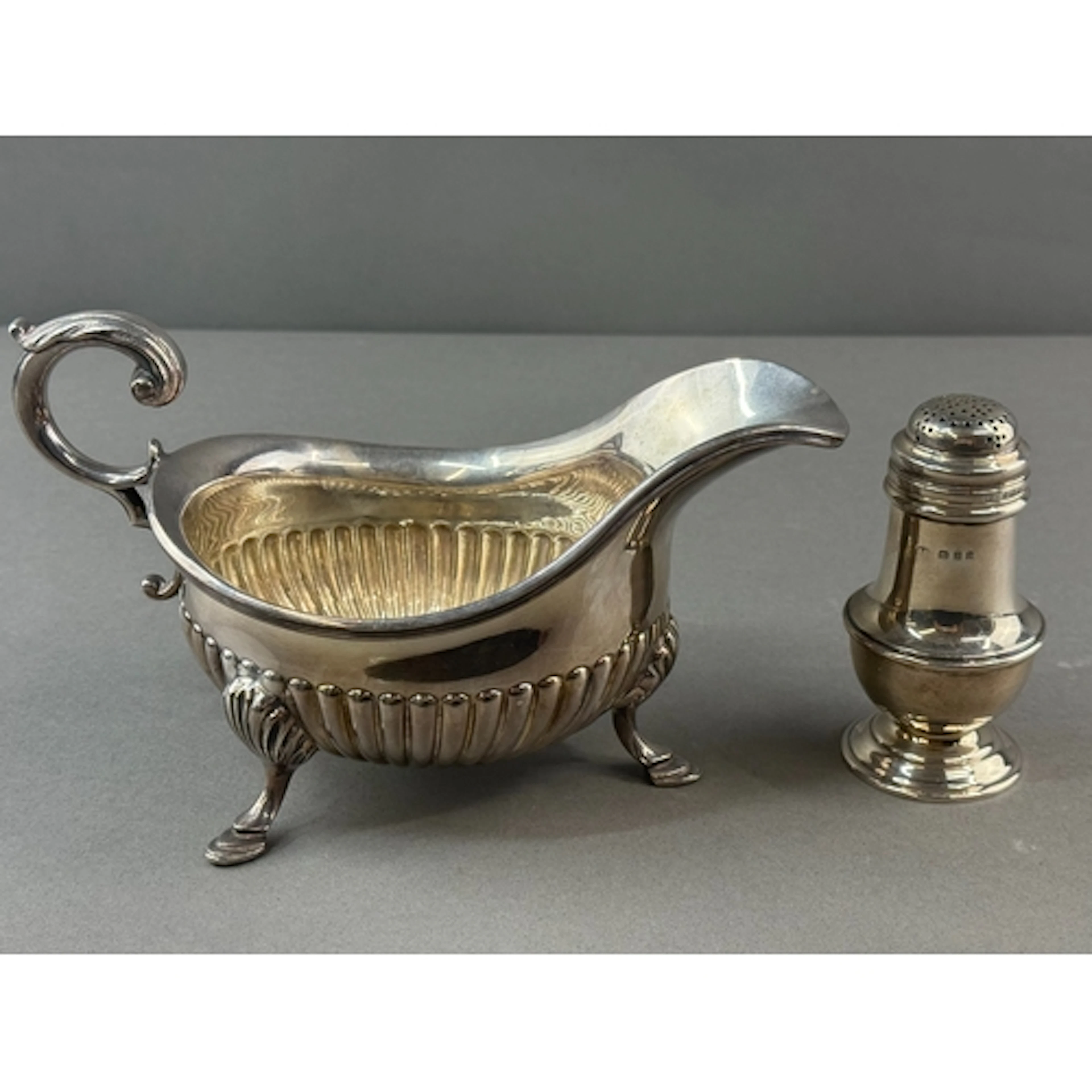 Silver: a pounce pot of baluster form by Charles Edwards, Lo...