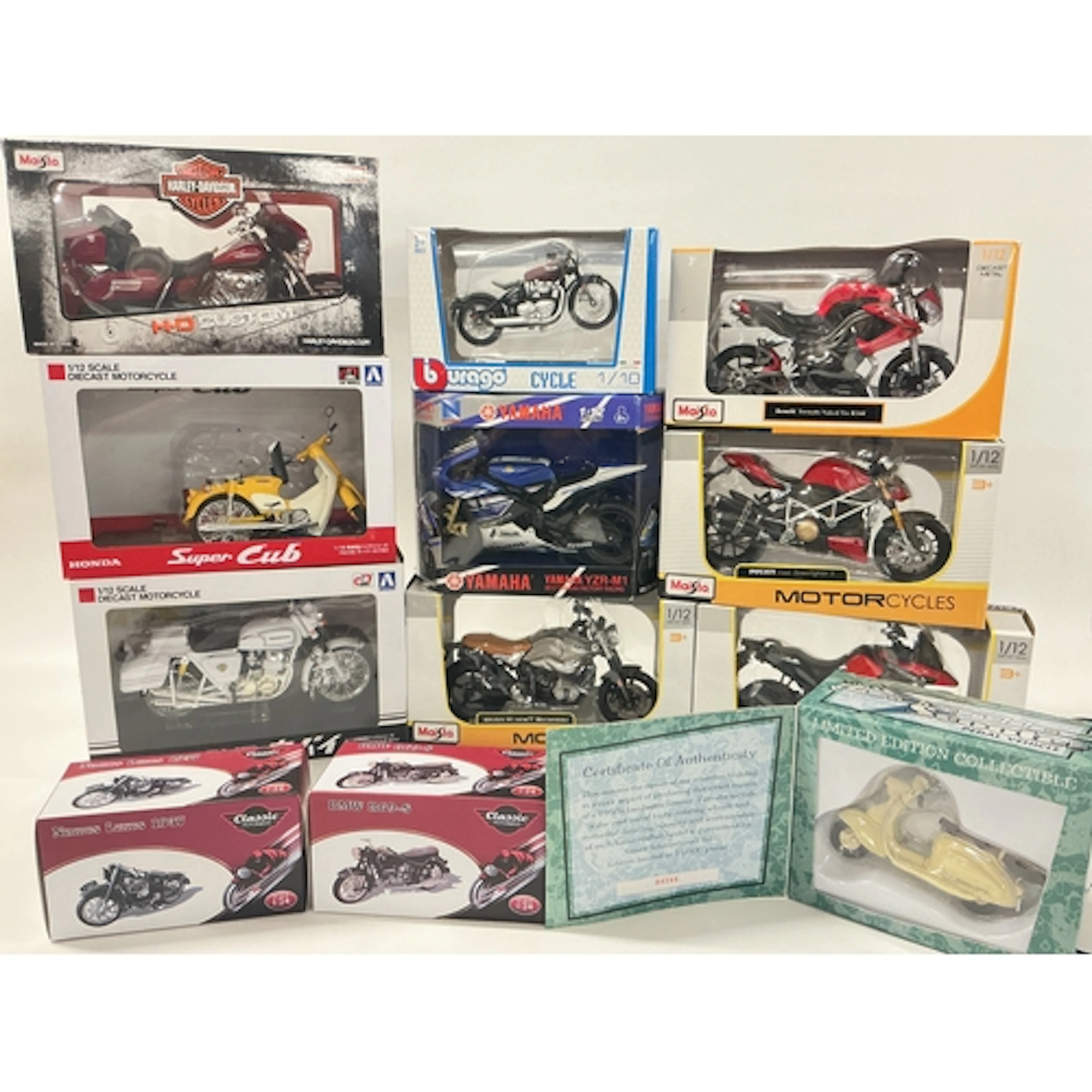 A Collection Of Boxed Diecast Motorcycles, Including Maisto,...