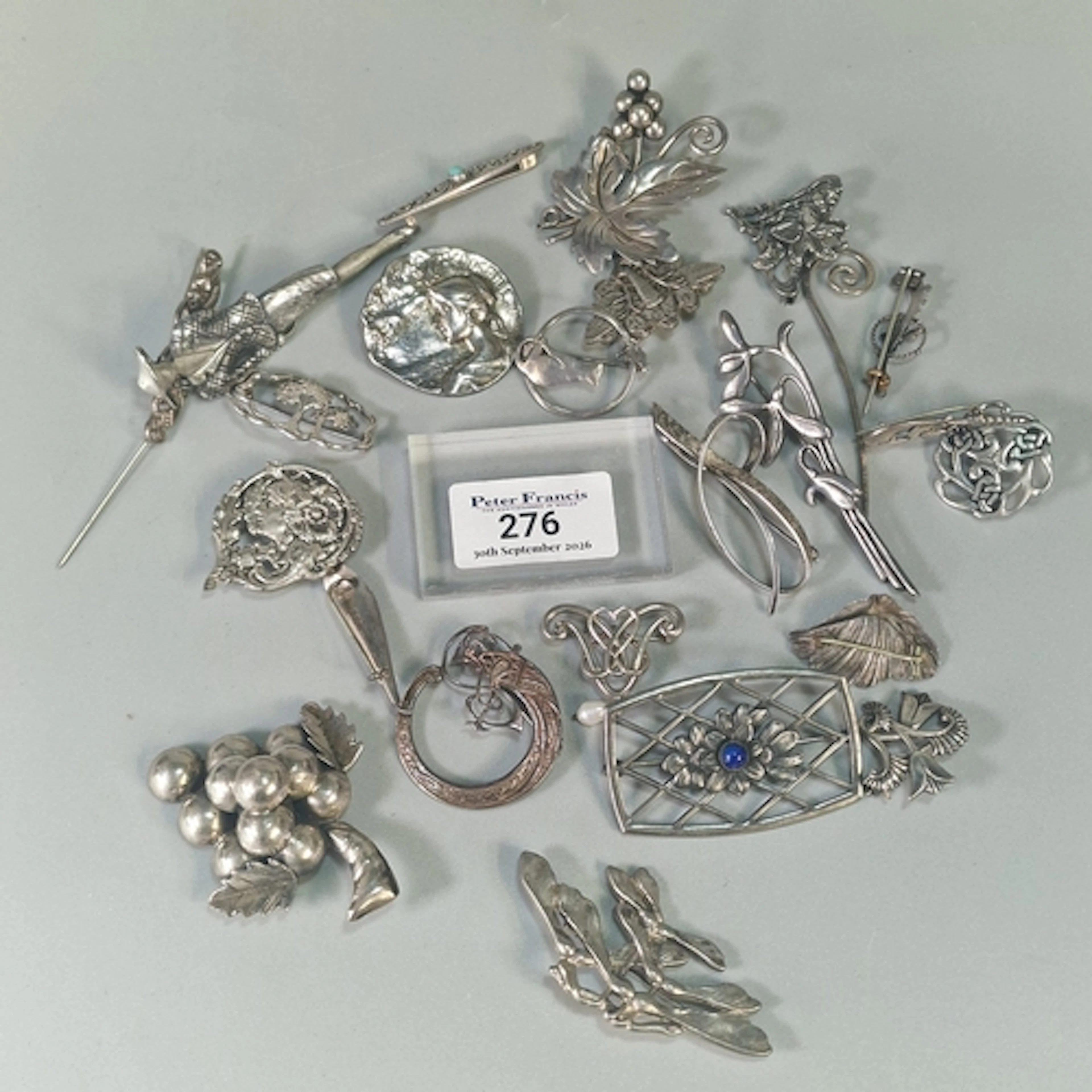 Large collection of silver and other brooches in the form of...