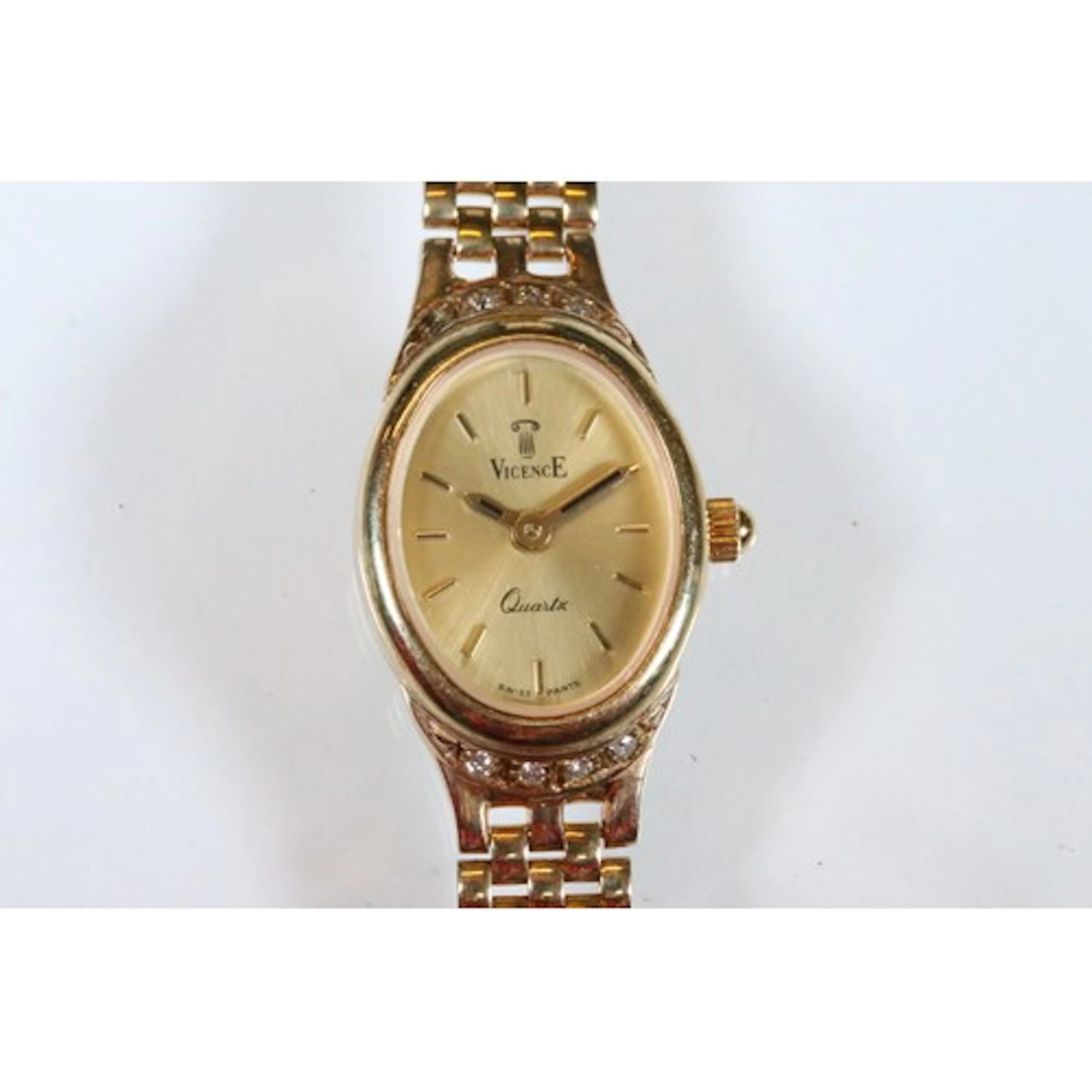 9ct gold Vicence ladies wrist watch having an oval gilt face...