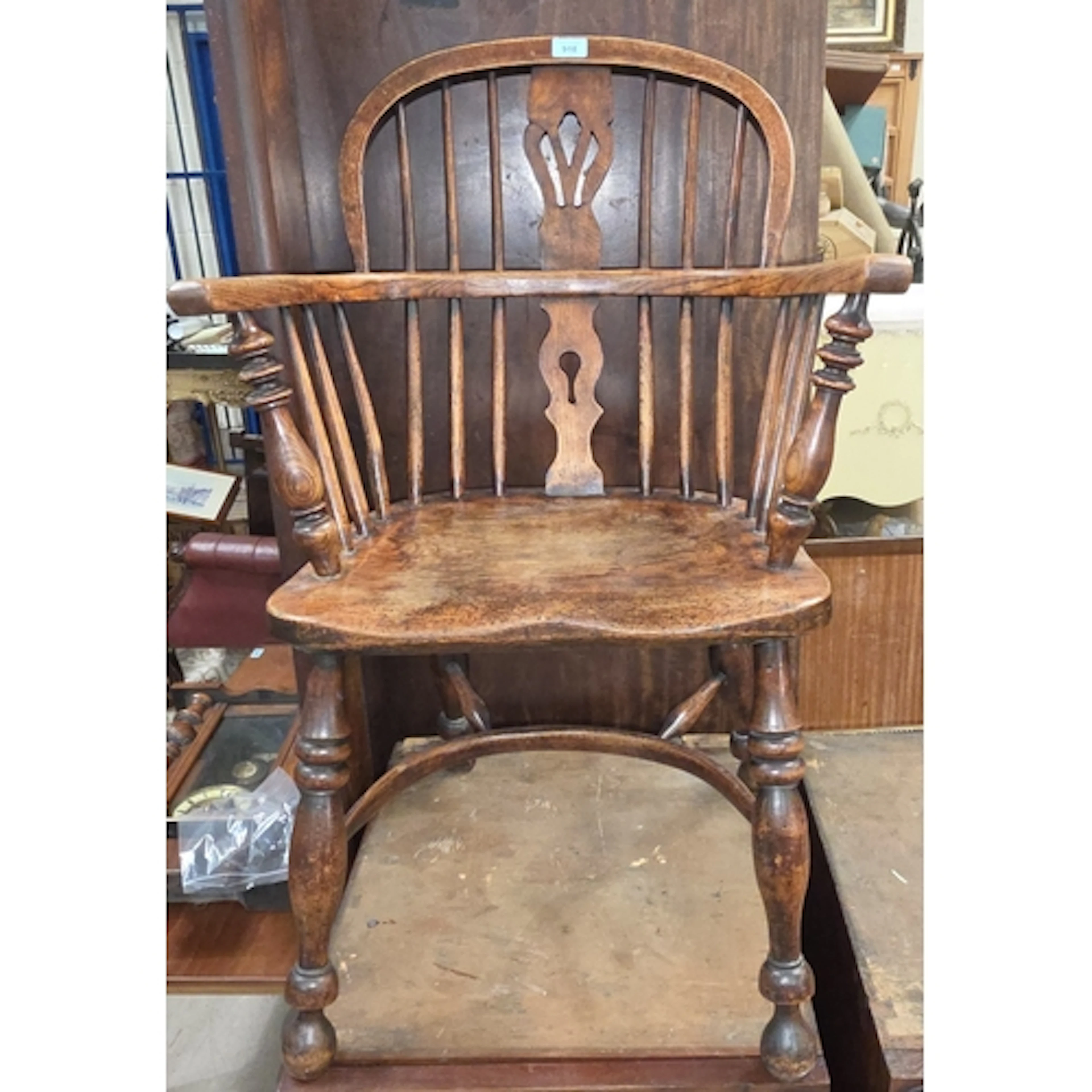 A 19th century yew and elm Windsor chair with pierced splat ...